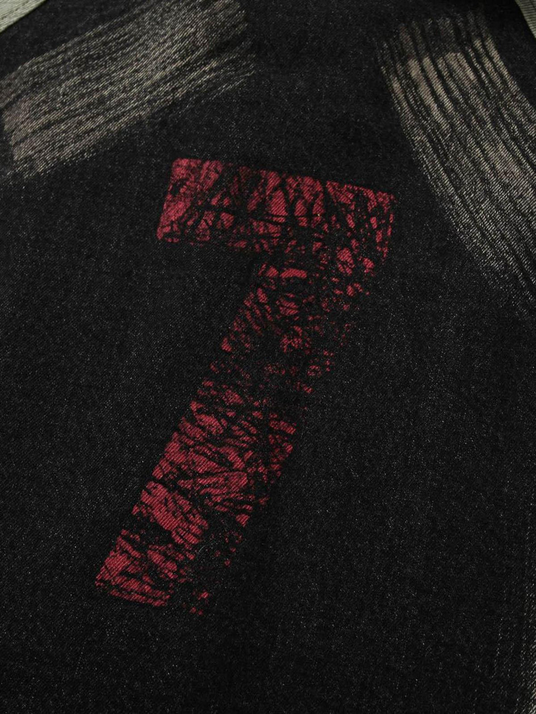 TALISHKO jacket features a bold red number seven design, adding edgy detail to the fabric.