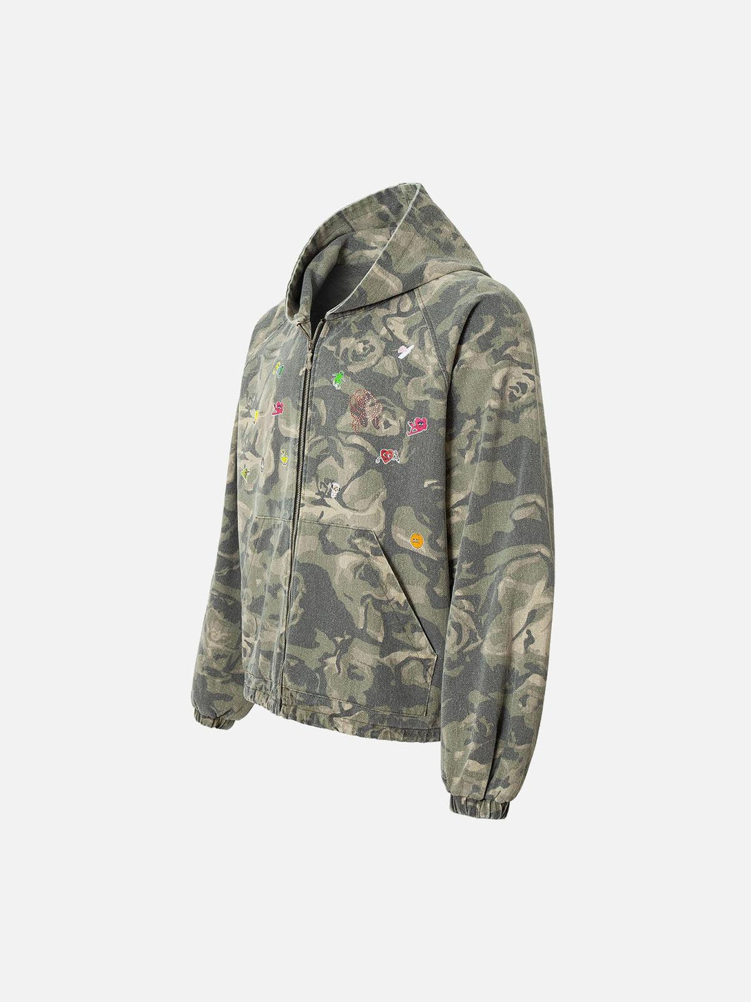 A side view of TALISHKO's graffiti camouflage hooded jacket featuring playful patchwork.