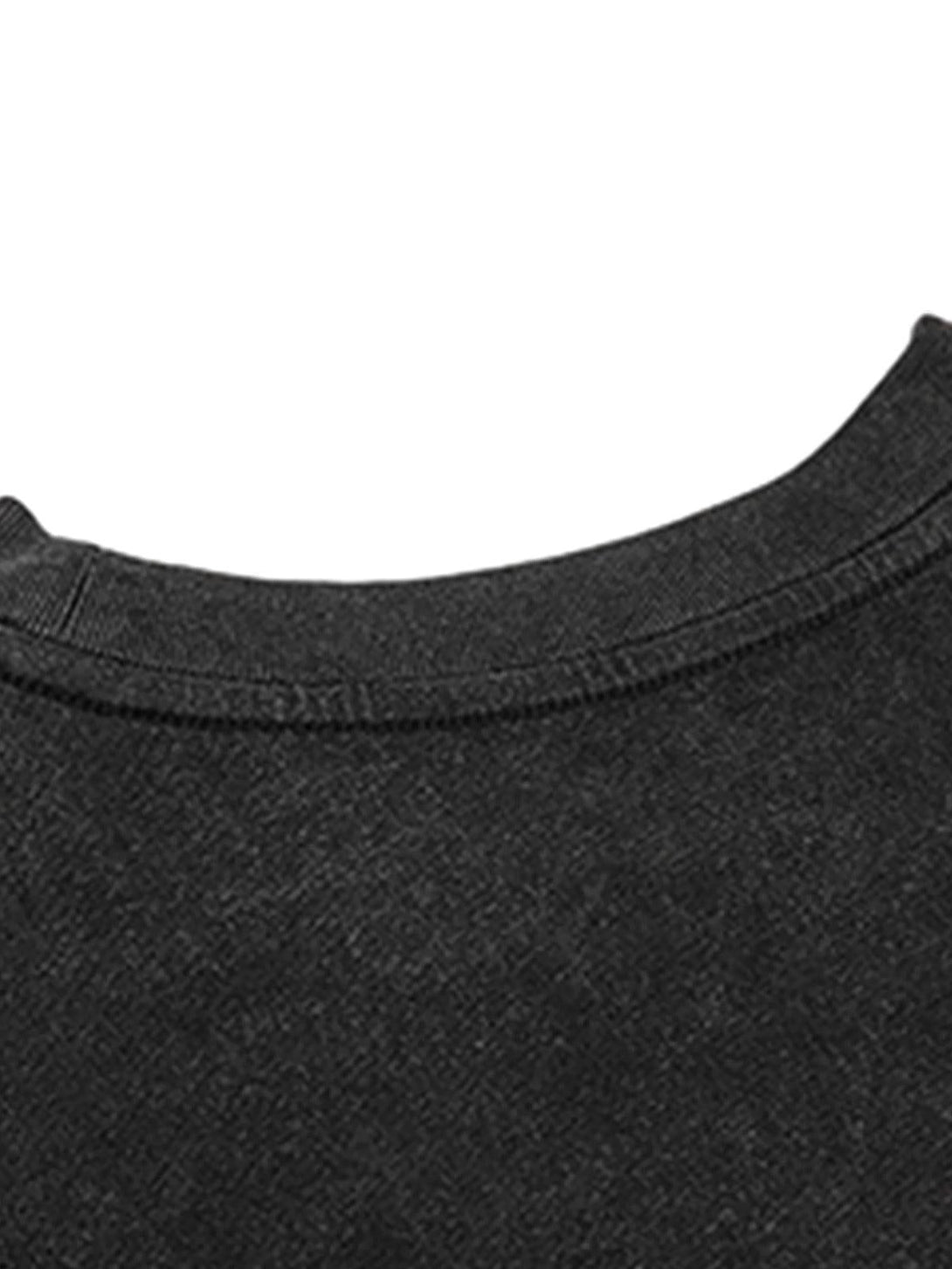 Focusing on the neckline detail of a black crew neck T-shirt by TALISHKO, highlighting texture.