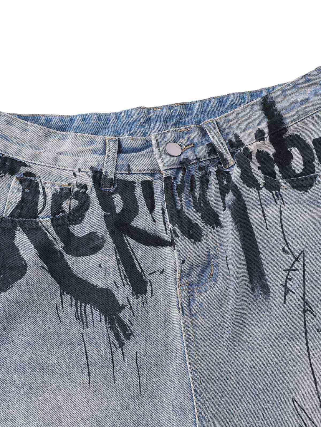A tight crop highlighting TALISHKO's graffiti lettering on denim shorts, showcasing artistic detail.