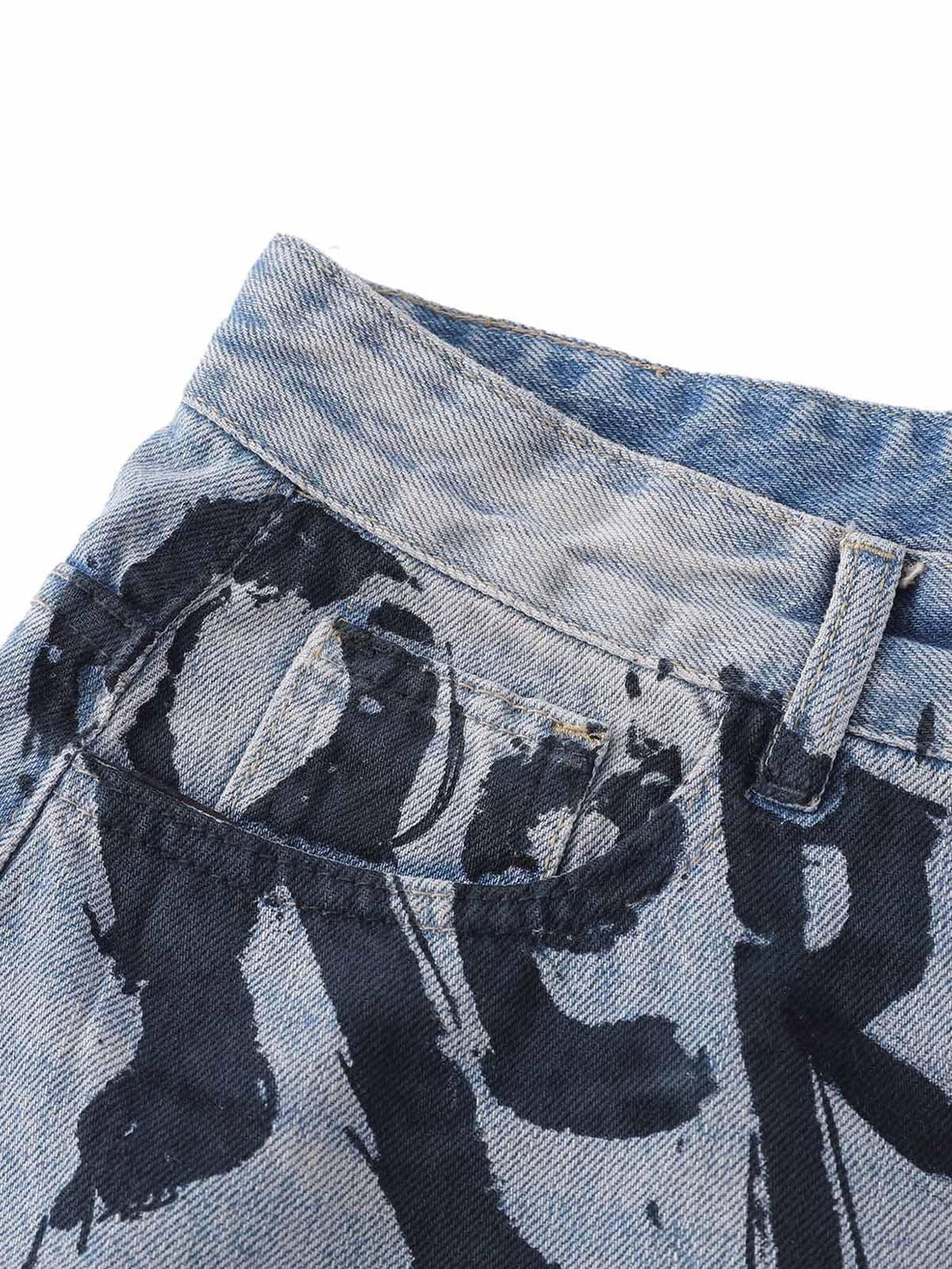 Focusing on the graffiti pattern on TALISHKO's denim shorts, showcasing bold artistic detail.
