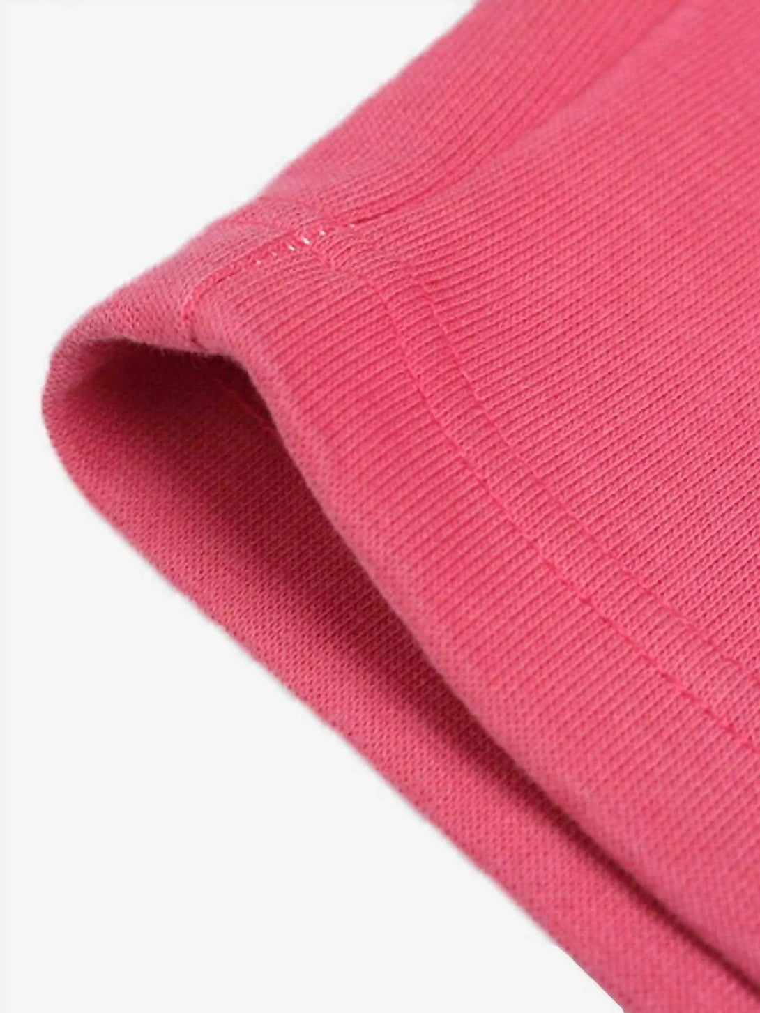 Pink fabric and stitching detail of a TALISHKO hoodie, highlighting its vibrant texture.