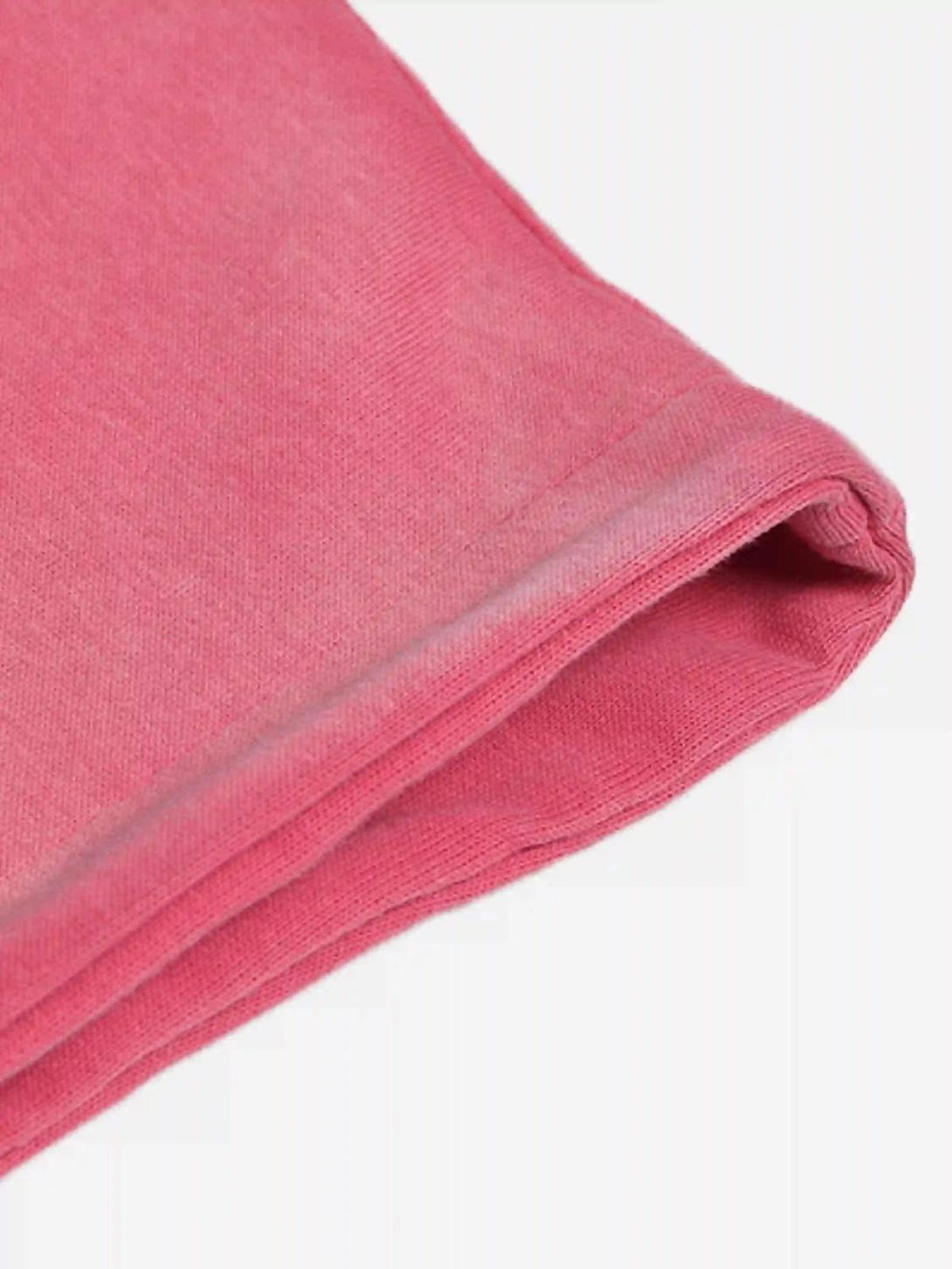 Detailed fabric and stitching of a pink hoodie by TALISHKO, showcasing its vibrant texture.