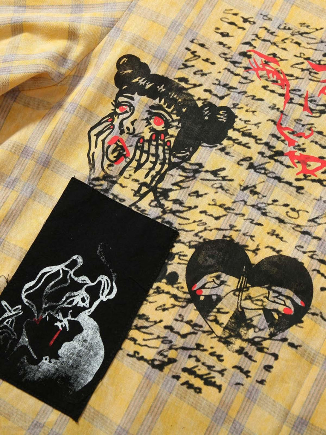 Intricate look at graffiti designs on a yellow plaid polo shirt by TALISHKO, showcasing urban flair.