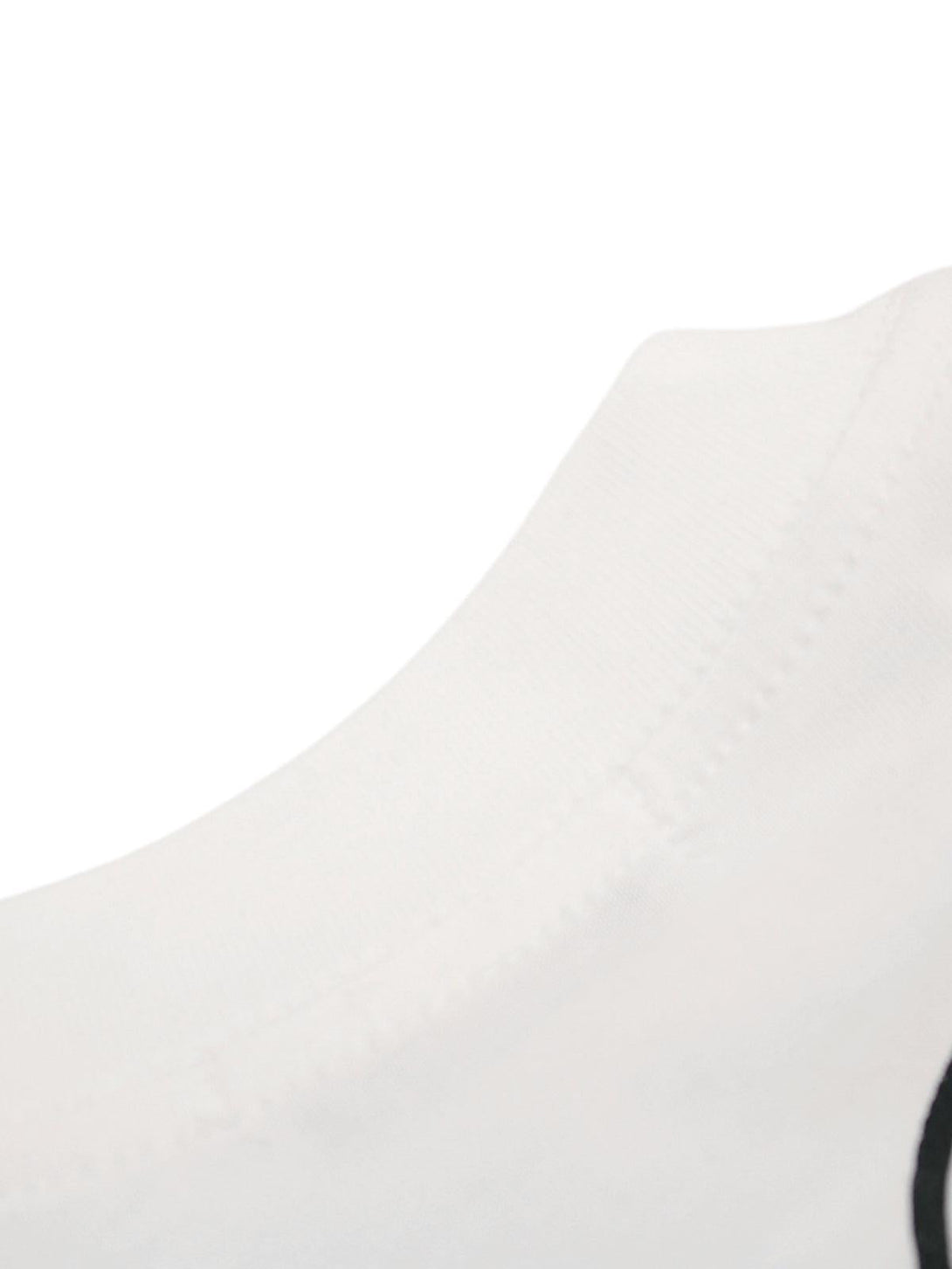 A tight crop highlighting the soft fabric and stitching on a TALISHKO graphic T-shirt.