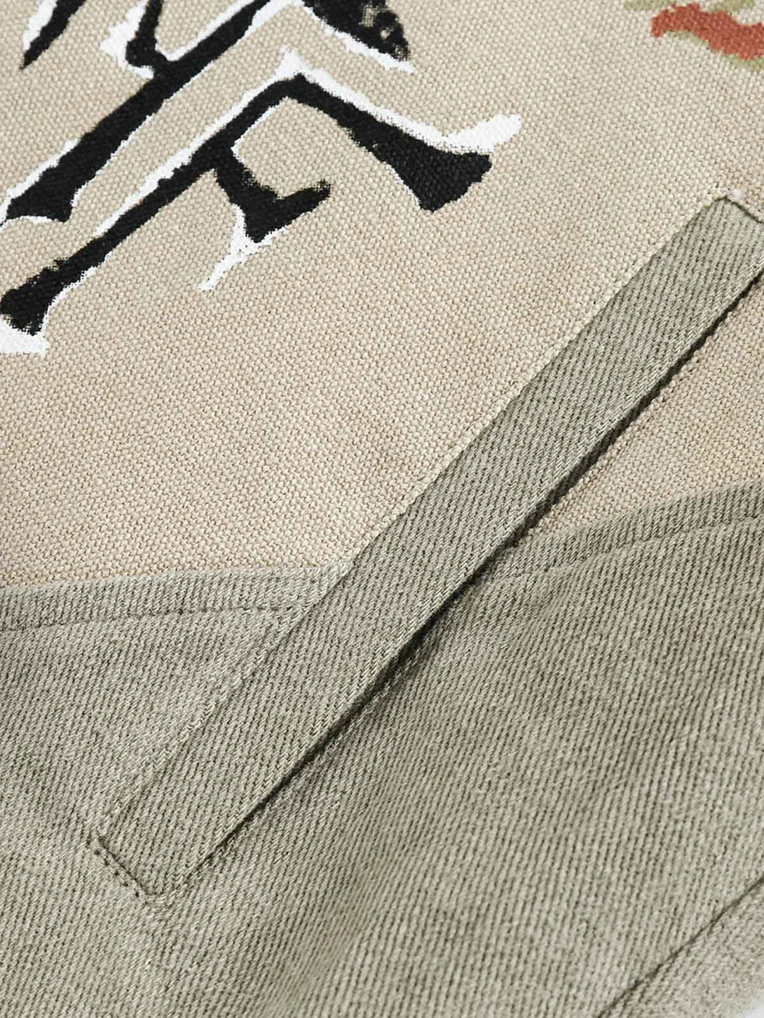 Texture and pattern showcased in the graffiti patchwork denim jacket by TALISHKO.