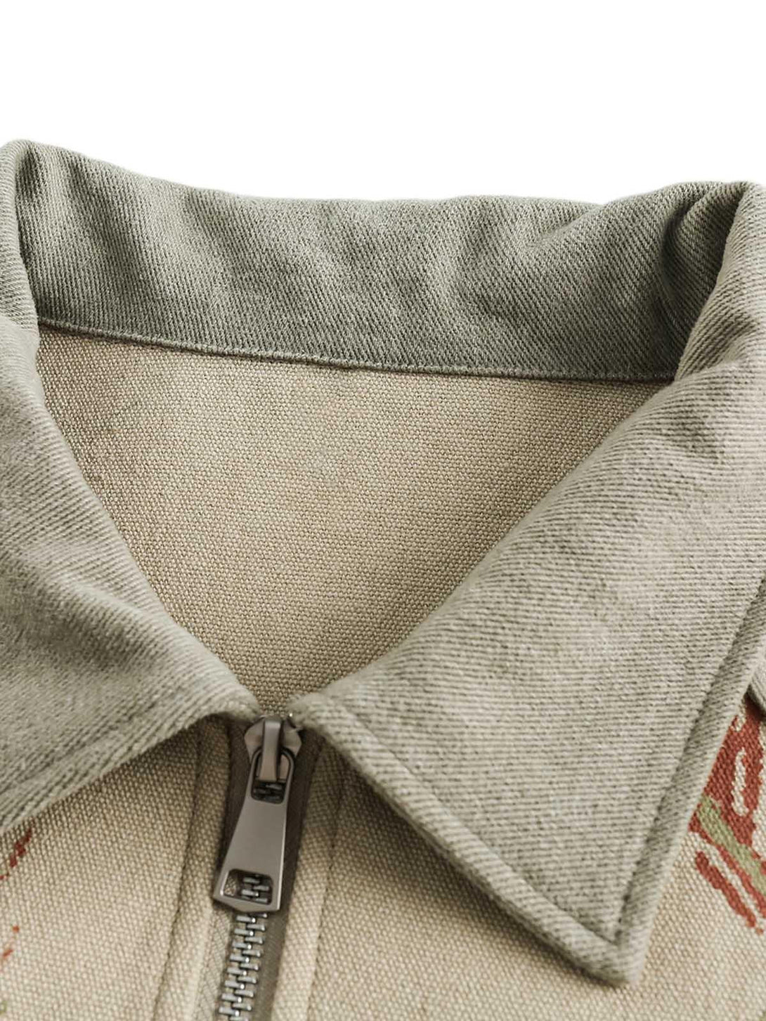 Intricate look at the graffiti patchwork and lapel details on the denim jacket by TALISHKO.