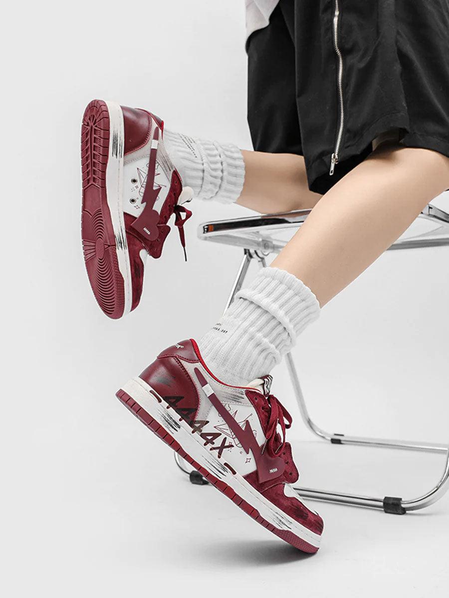 A stylish look with TALISHKO graffiti skate shoes in red and white, worn with casual socks.