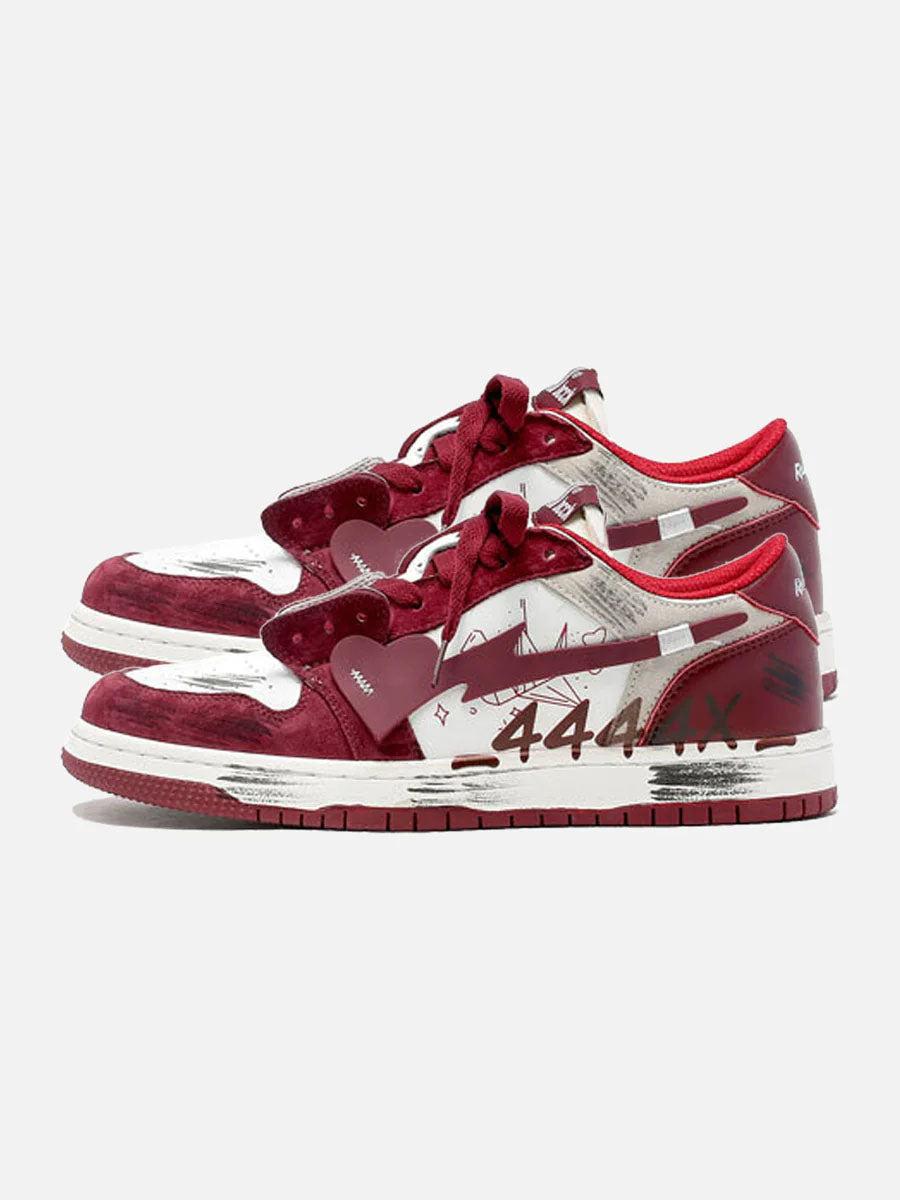 TALISHKO graffiti skate shoes with bold red and white details, showcasing side view design.