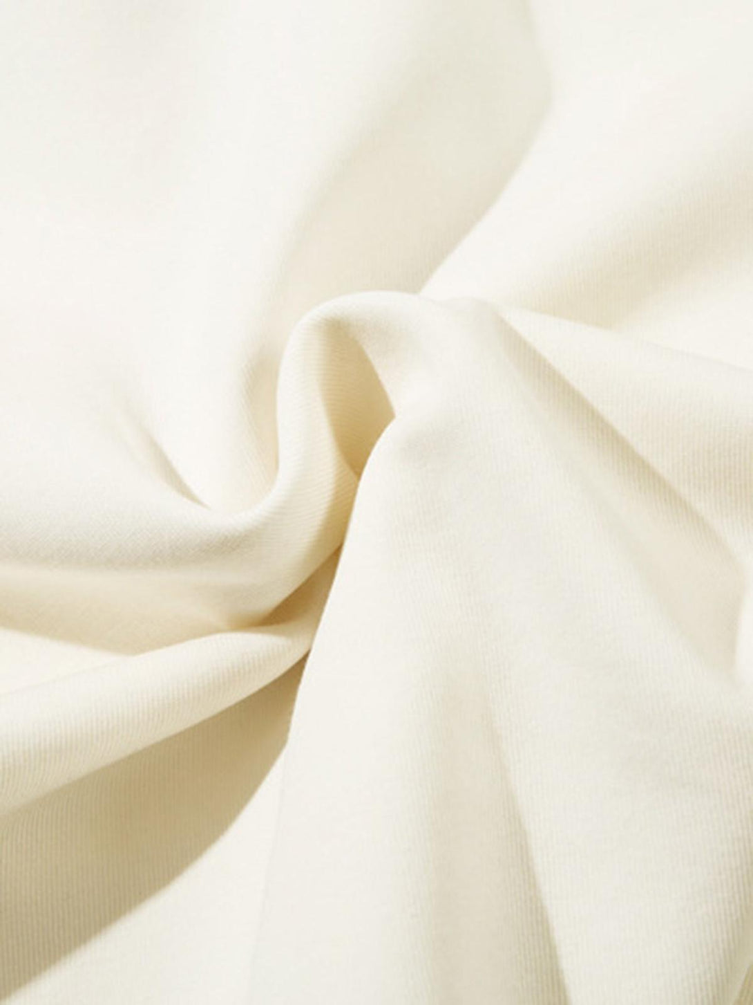 Detailed fabric and stitching on a TALISHKO hoodie, showcasing its soft texture and quality.