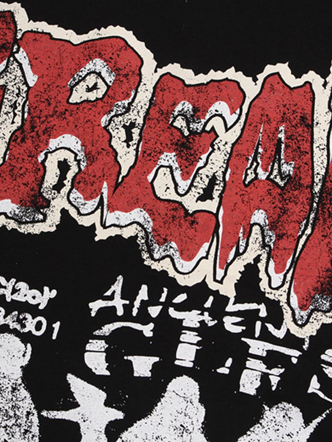 Focusing on the edgy design of TALISHKO's graphic "BREAK" print T-shirt, highlighting bold textures.