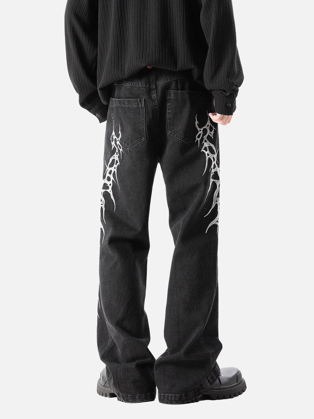 TALISHKO graphic embroidered jeans in a streetwear style, highlighting bold side designs.