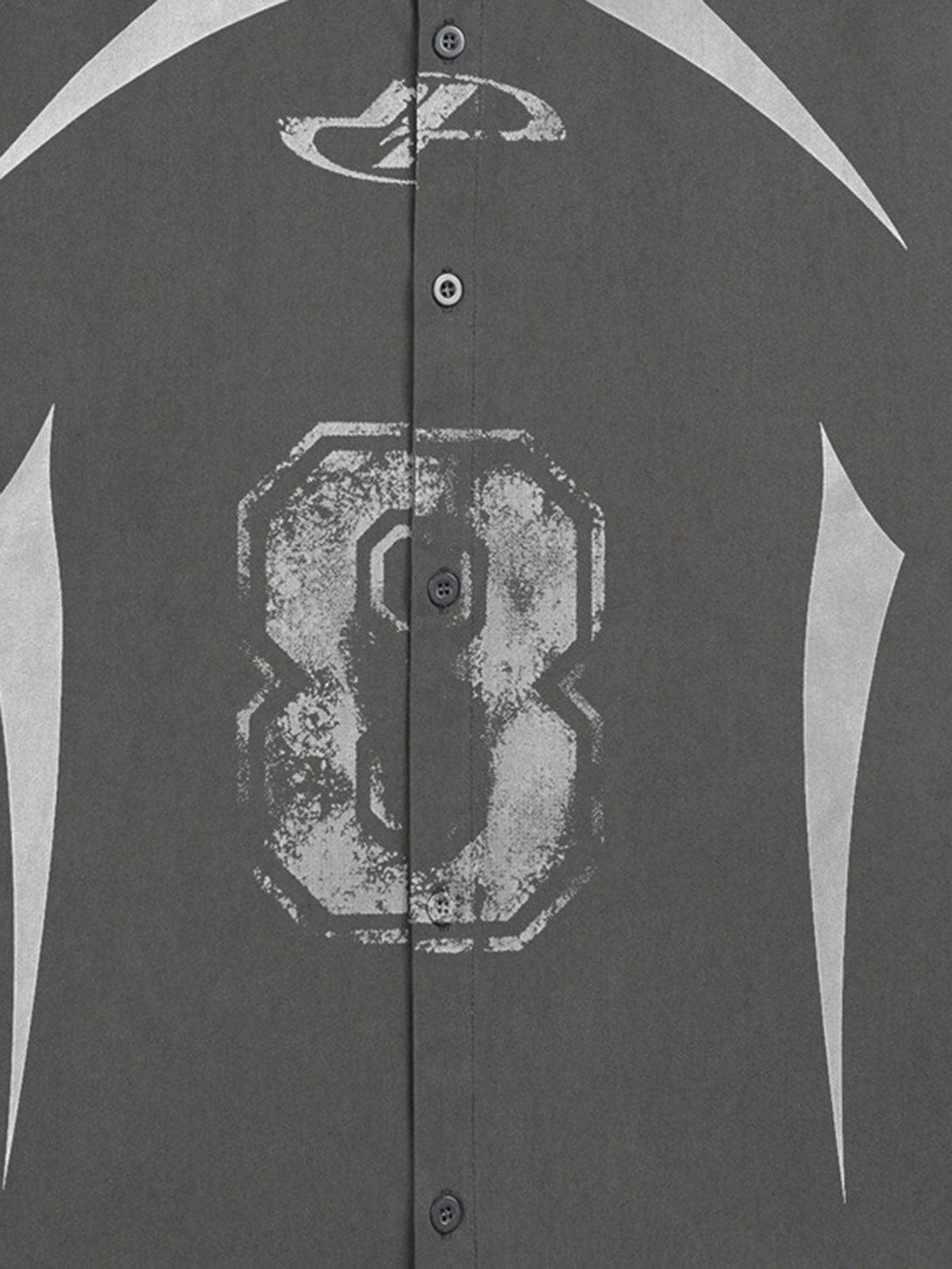 TALISHKO shirt detailed view, showcasing a bold number graphic and button details on dark fabric.