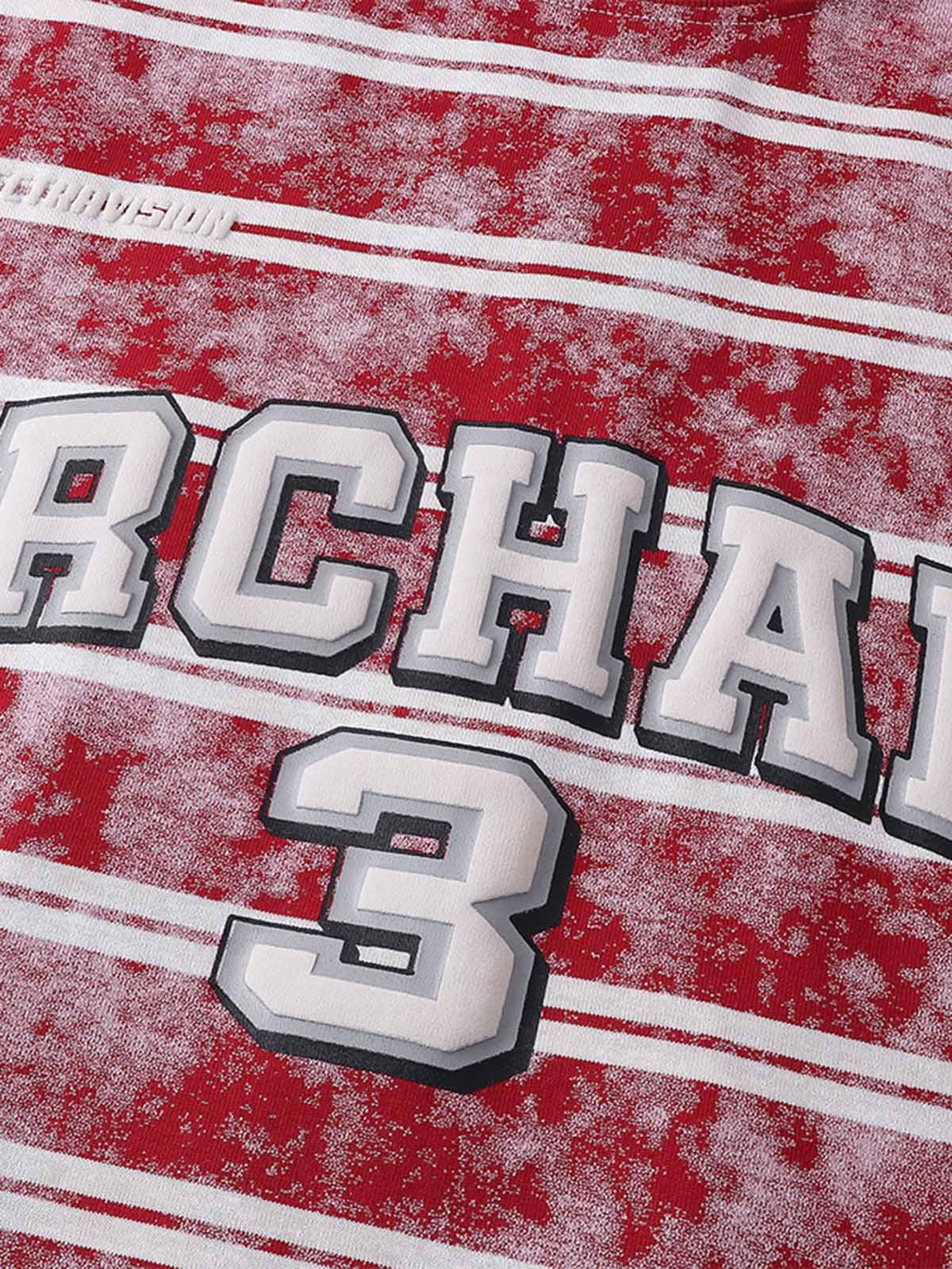 Intricate look at TALISHKO's red striped T-shirt with bold graphic lettering and number design.