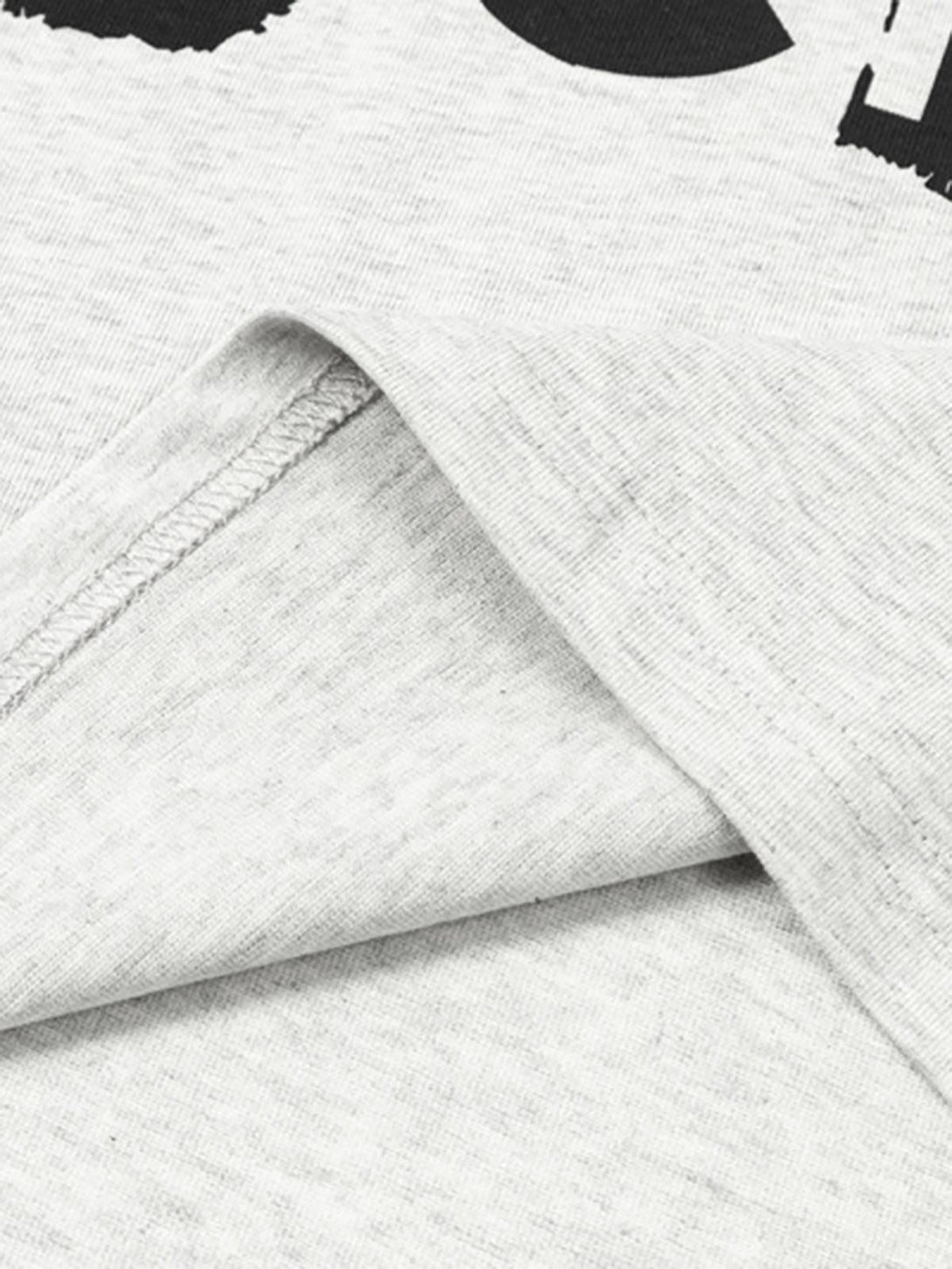 Detailed fabric and stitching of TALISHKO graphic T-shirt, highlighting soft gray material.