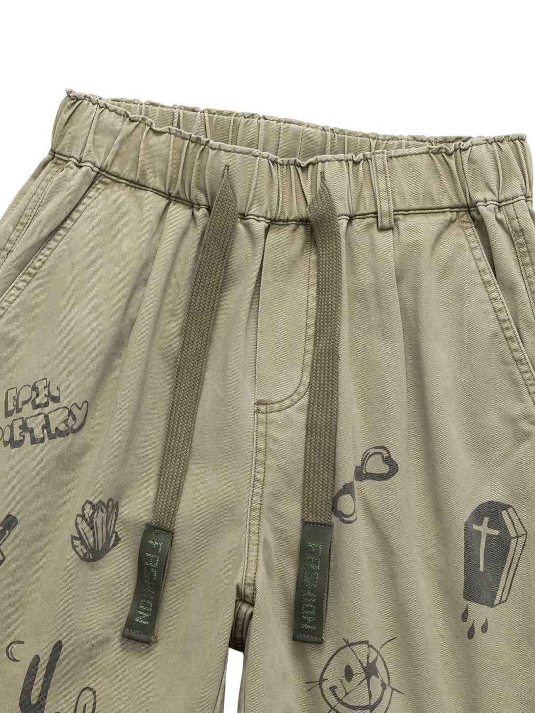 A close-up of TALISHKO drawstring shorts with playful graphics, highlighting casual summer style.