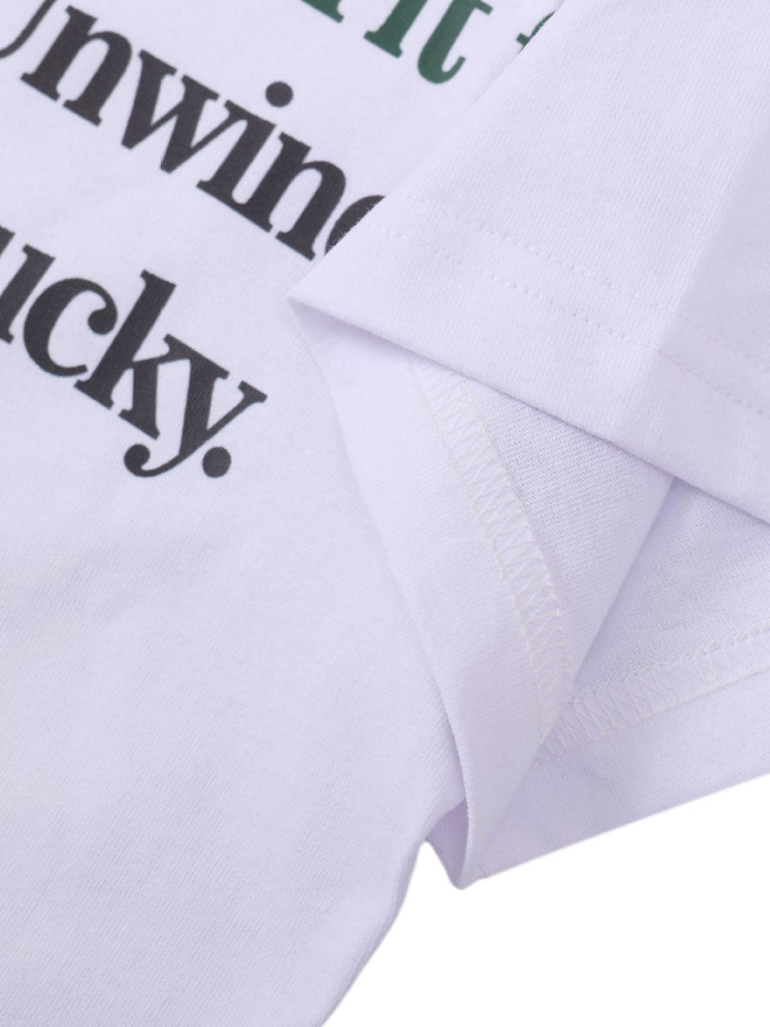 Detailed fabric and stitching of a TALISHKO graphic T-shirt, emphasizing casual summer style.