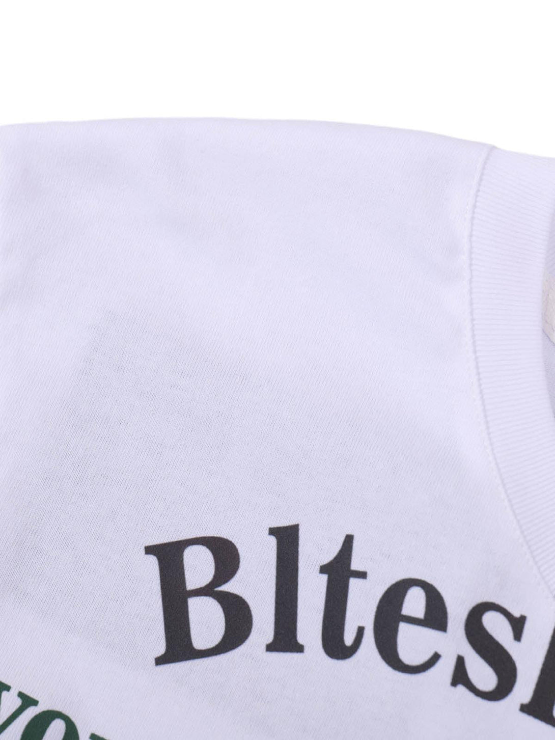 A close-up of the text design on a TALISHKO T-shirt, highlighting casual summer flair.