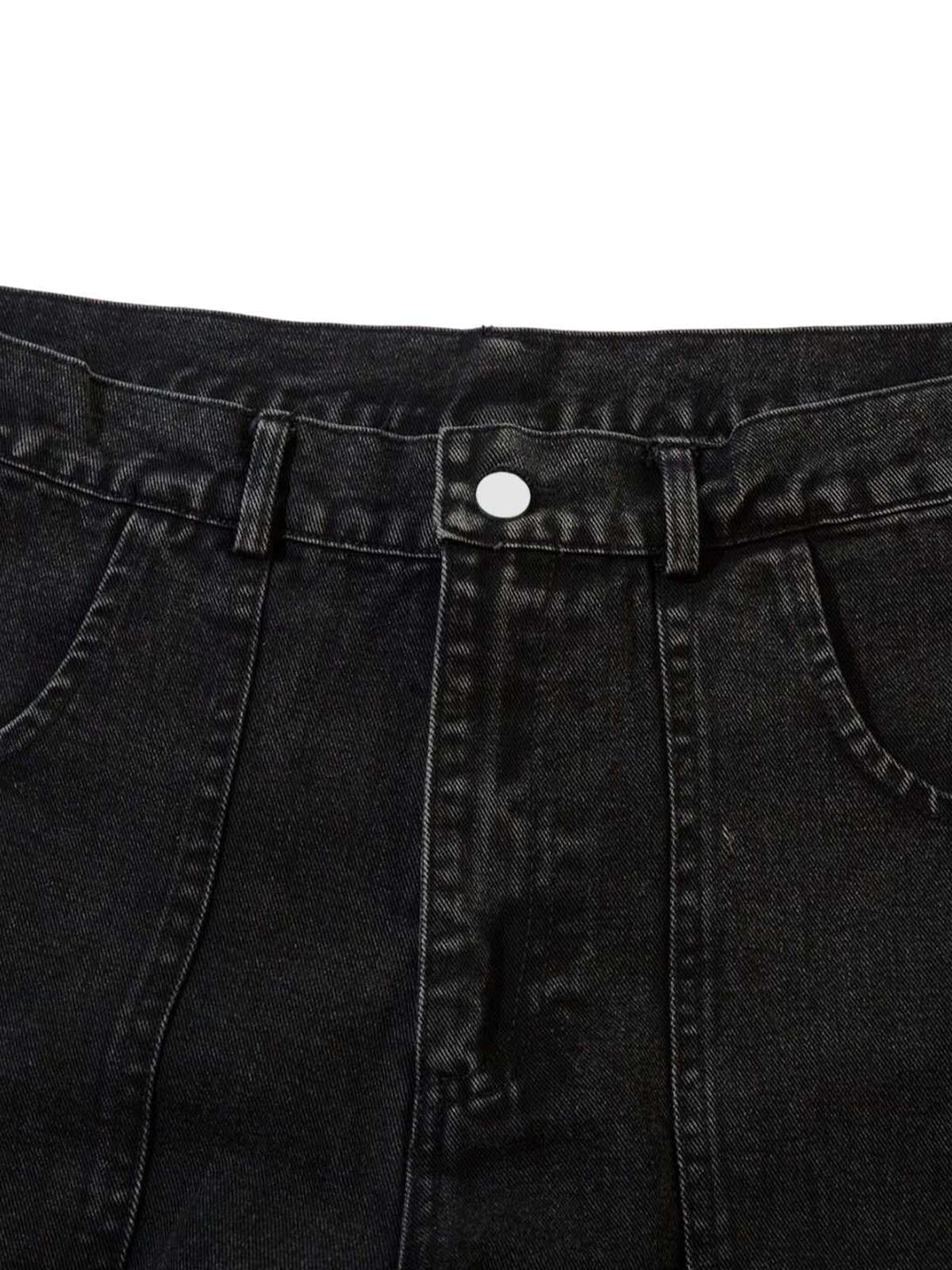 Intricate look at TALISHKO cargo jeans, highlighting grommet accents and pocket details.