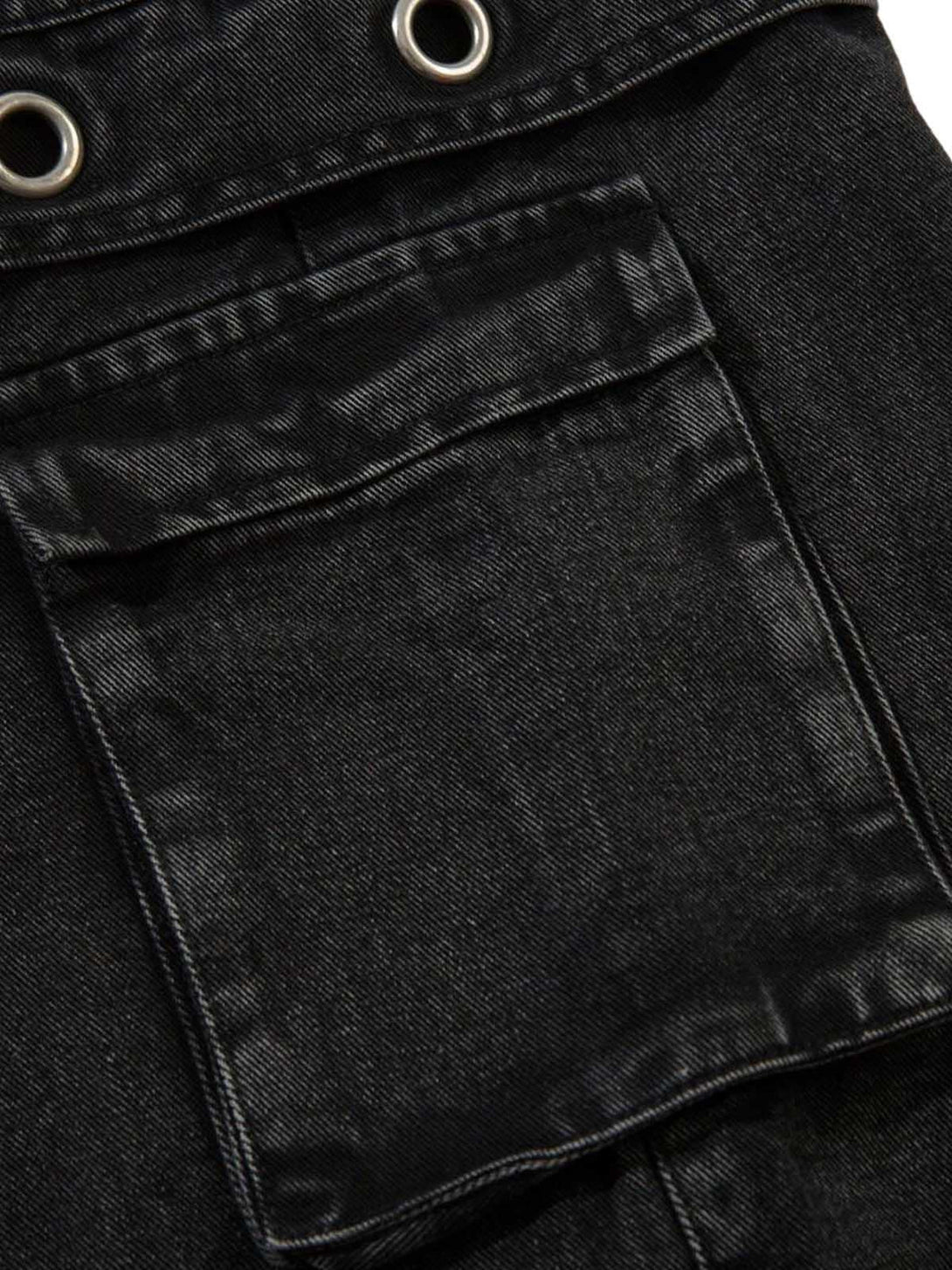 TALISHKO cargo jeans detail, showcasing grommet accents and pocket design in close-up view.