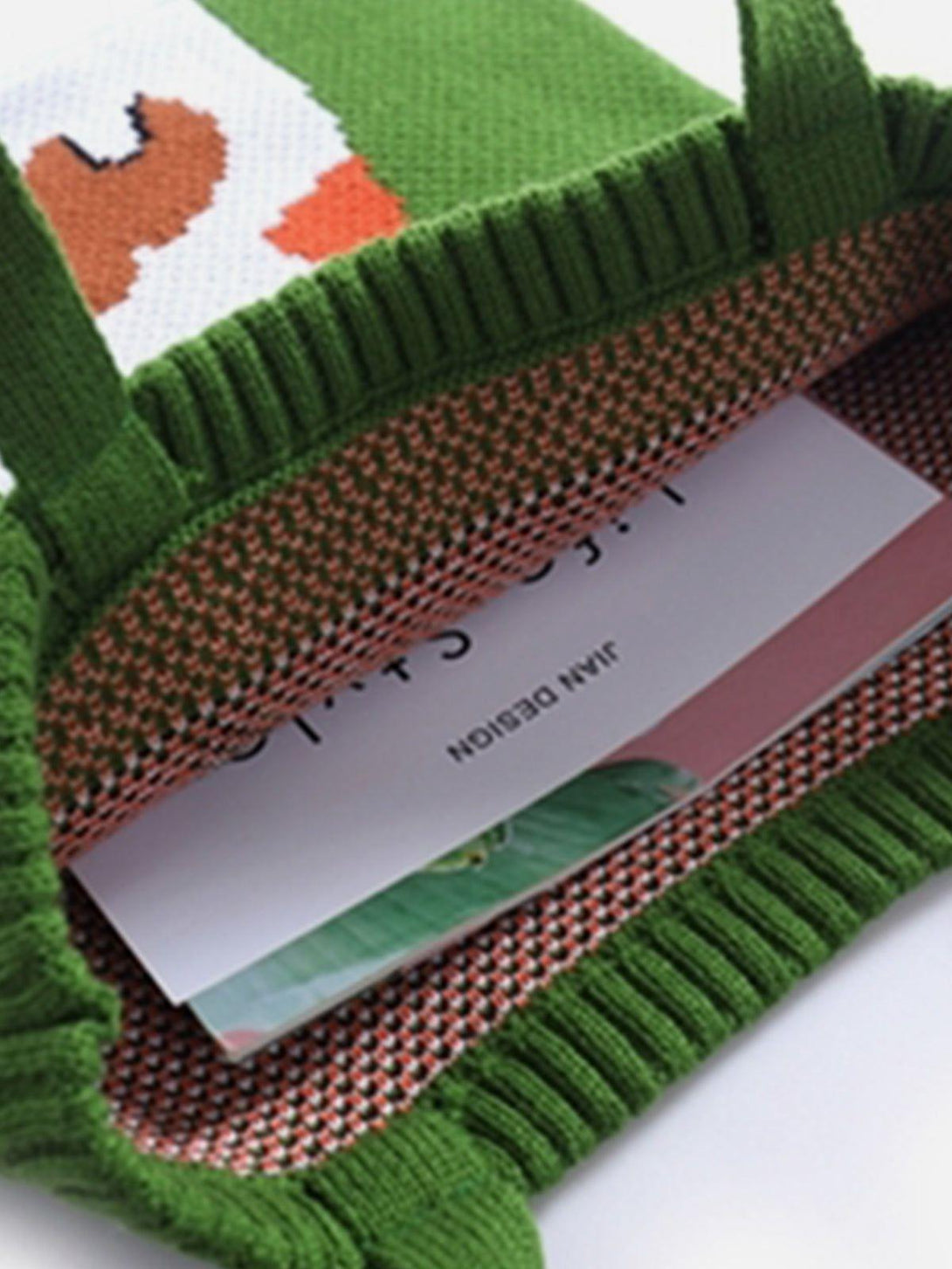 A peek inside the TALISHKO "Guitar Cat" knitting bag, highlighting its vibrant interior design.
