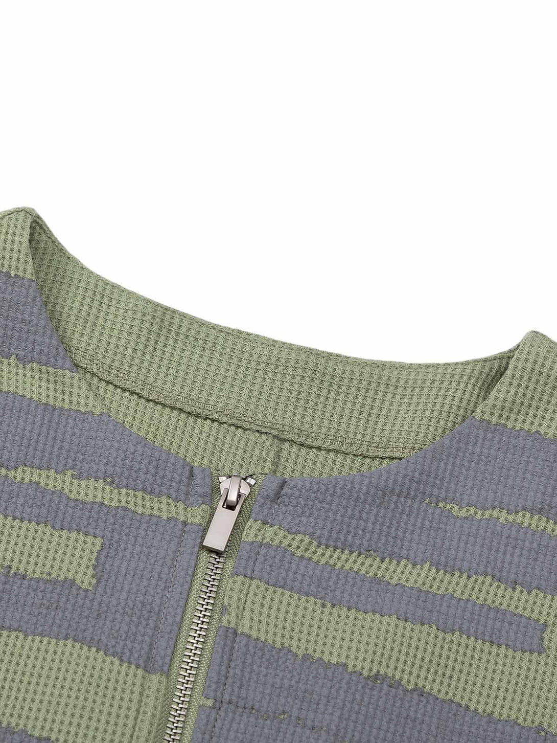 Intricate look at TALISHKO's half zip crew neck sweater, highlighting the unique knit pattern.