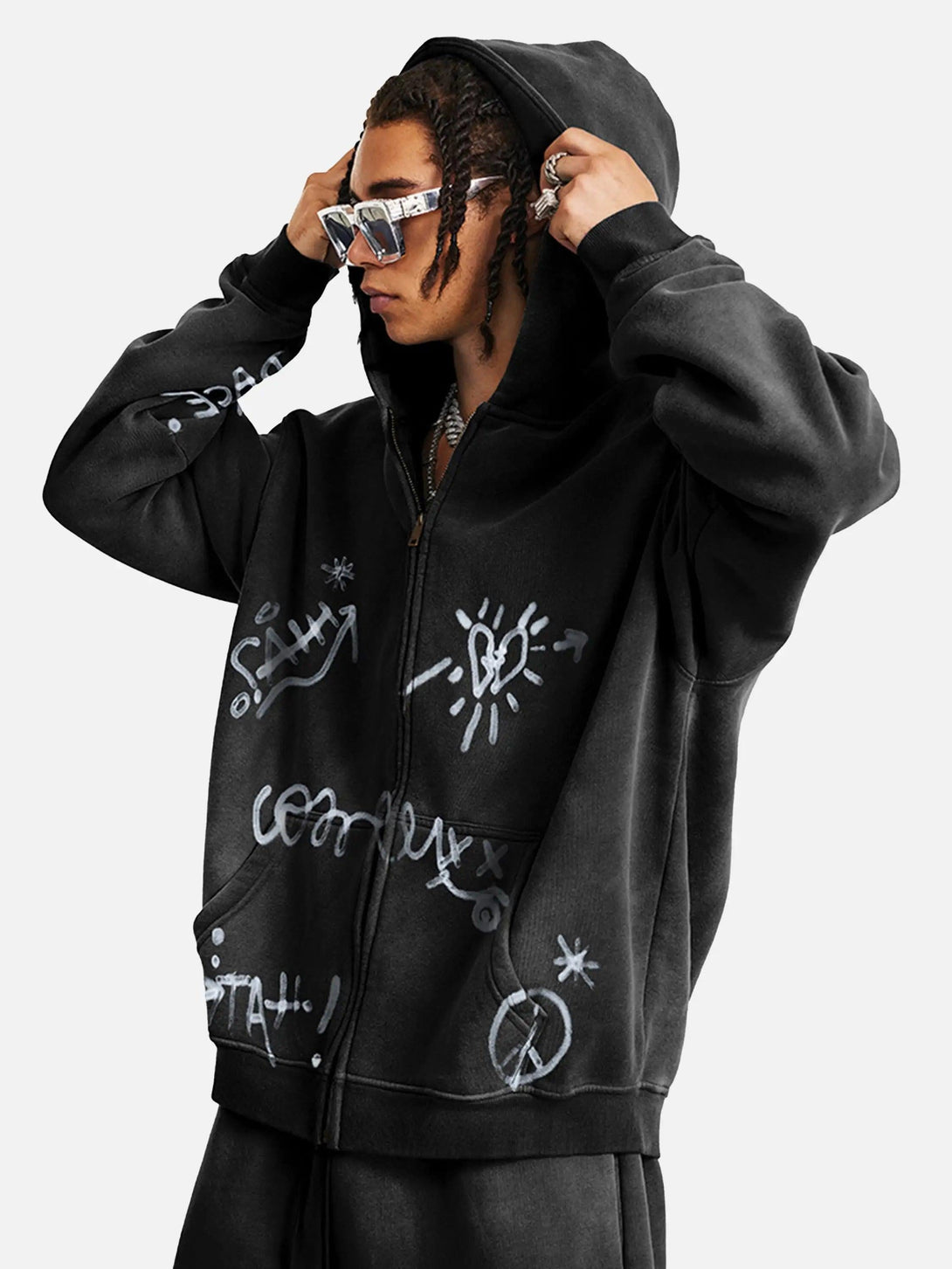 Model styled in TALISHKO's thick hoodie, showcasing hand-drawn graffiti and urban flair.