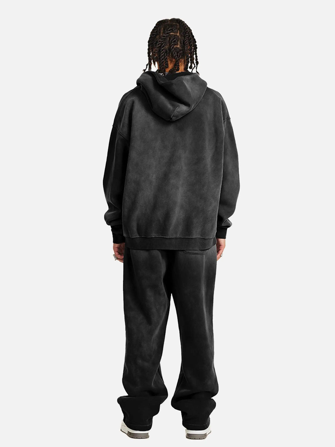 Back view of TALISHKO's thick hoodie and pants, highlighting a relaxed, urban style.