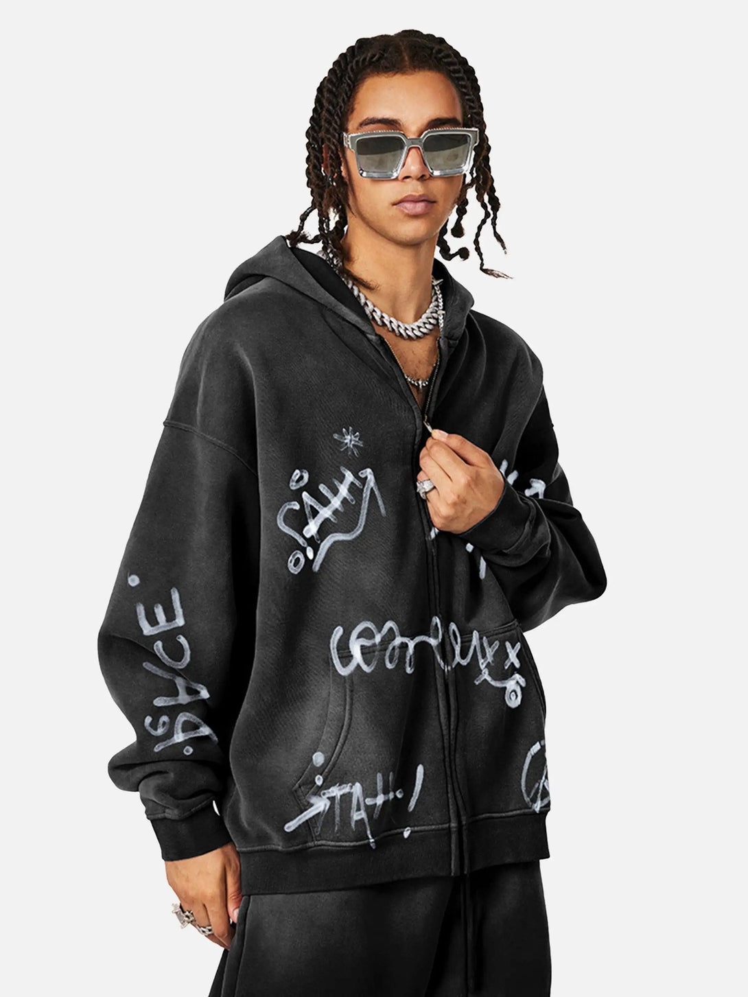 Model wearing TALISHKO's hand-drawn graffiti washed hoodie with bold, artistic details.