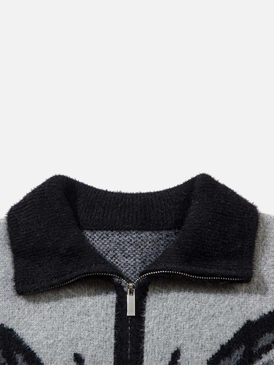 A close-up of TALISHKO's mohair cardigan, highlighting the textured collar and zipper detail.