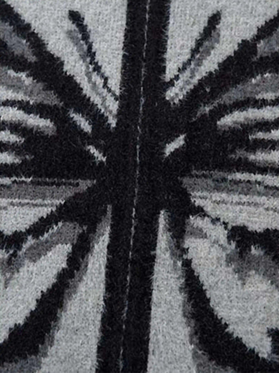 A detailed look at TALISHKO's mohair cardigan, highlighting the intricate butterfly design.