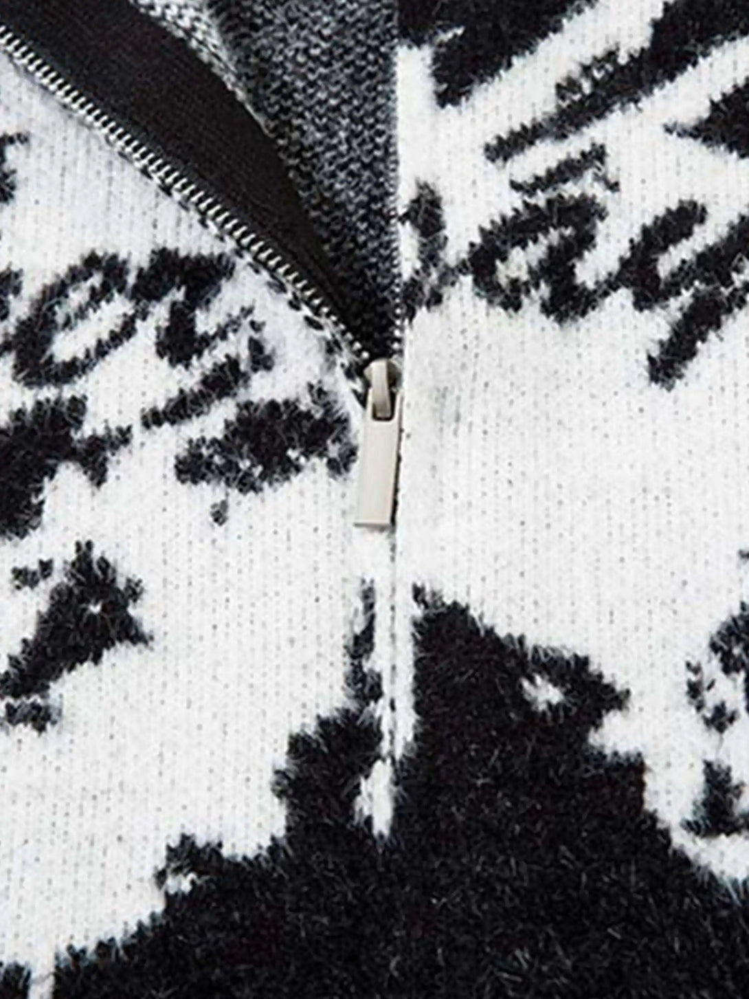 TALISHKO cardigan's zipper detail highlights the bold butterfly and slogan jacquard design.