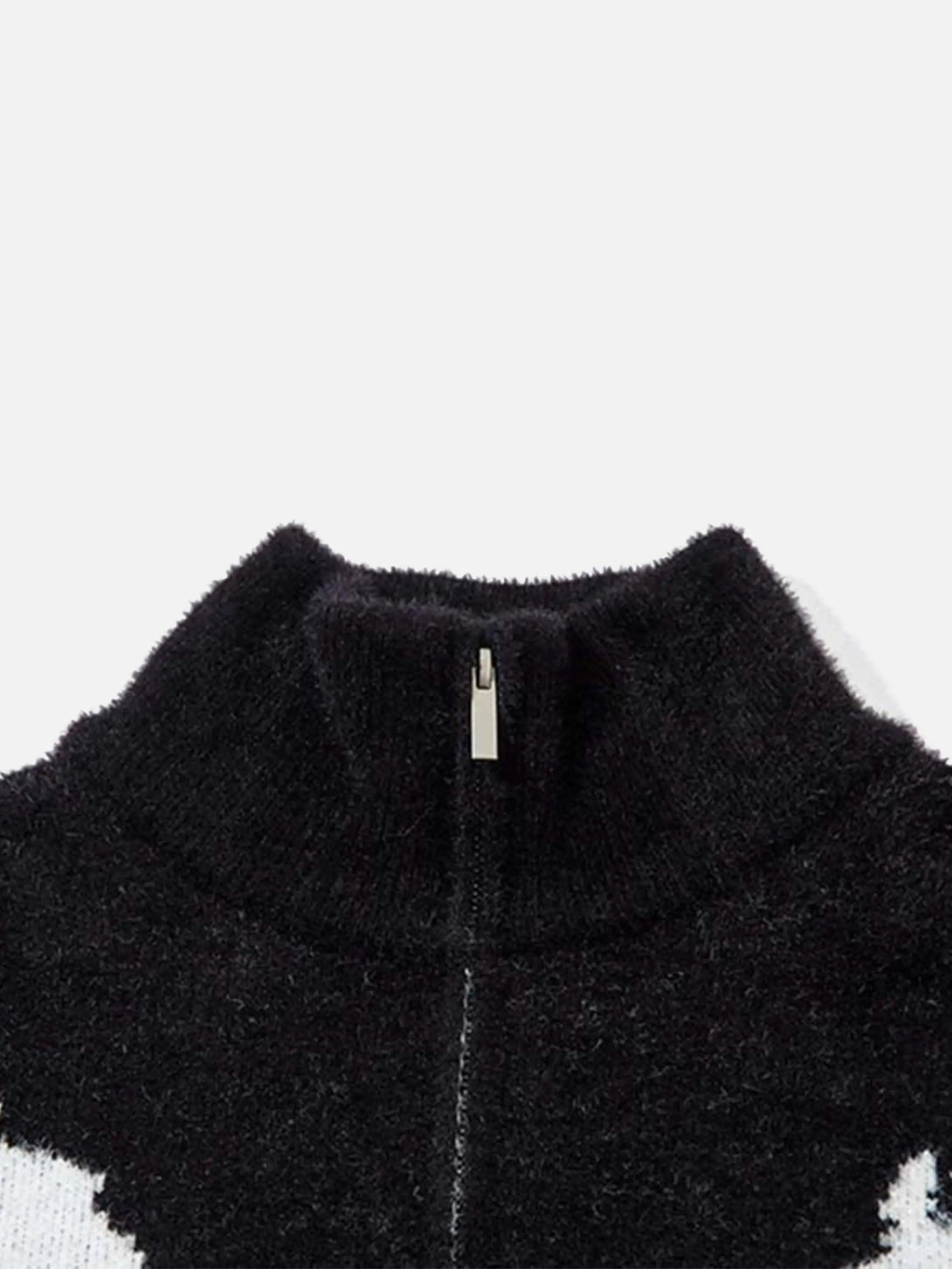 A detailed look at the TALISHKO cardigan's neckline zipper and soft jacquard texture.