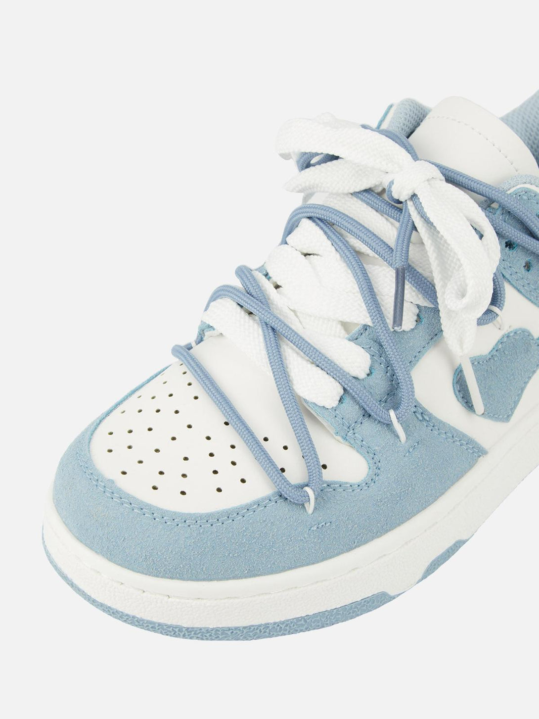 TALISHKO board shoes in haze blue, highlighting the intricate lace design and breathable material.