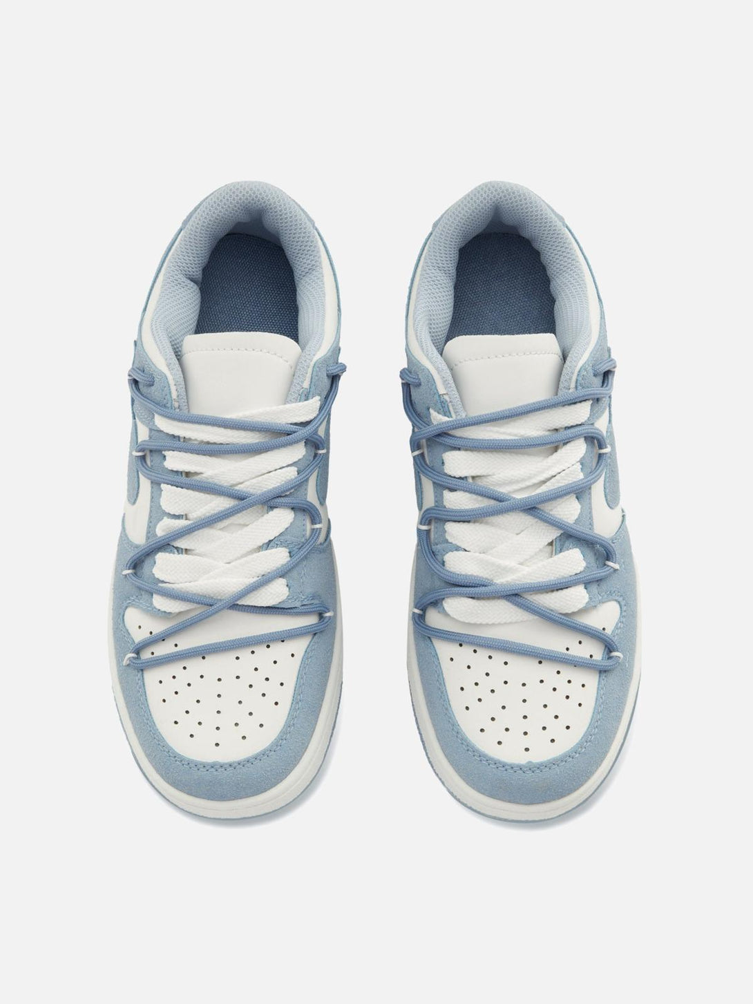 Focusing on the top view of TALISHKO haze blue board shoes with stylish criss-cross laces.