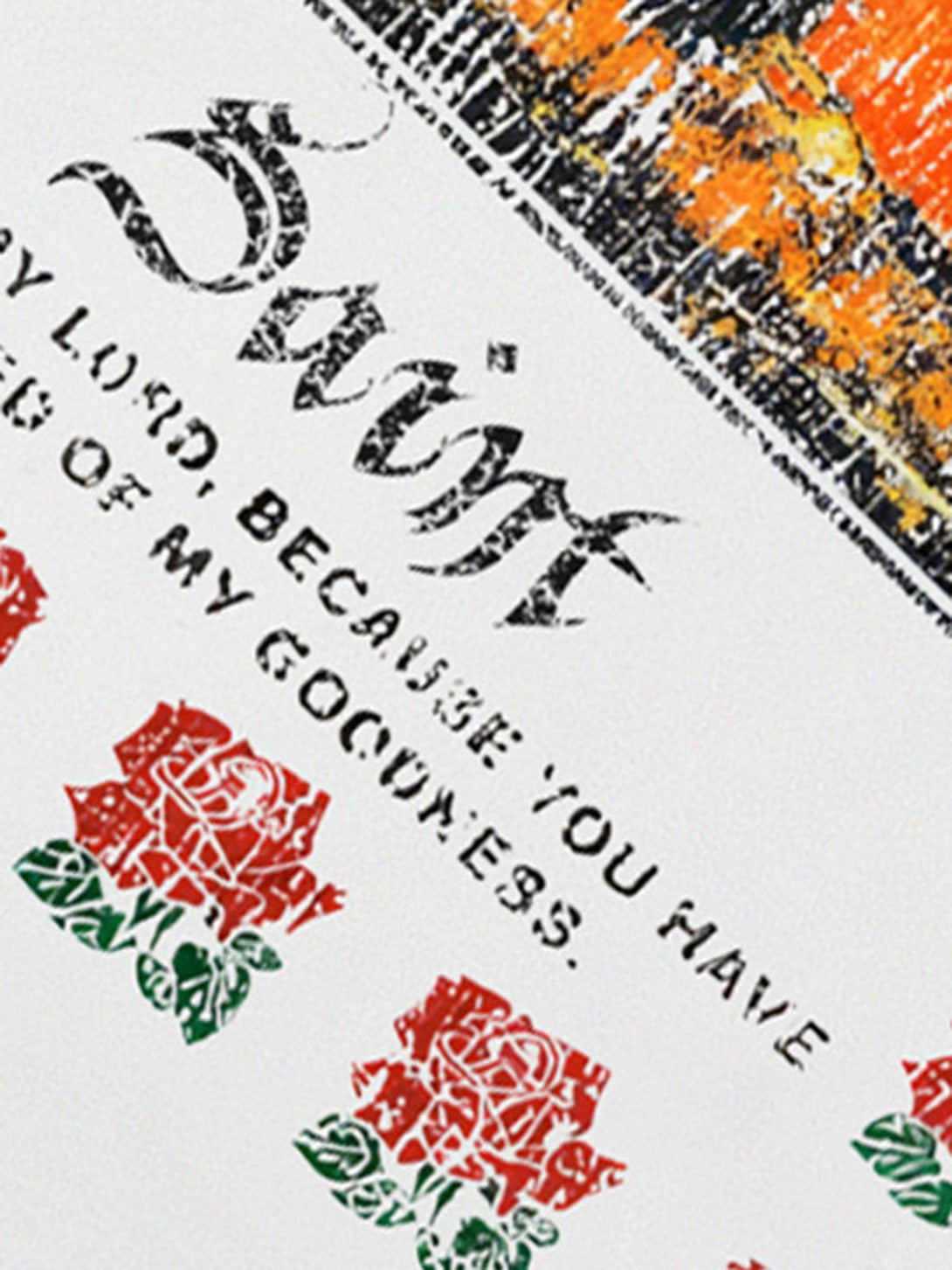 Intricate look at TALISHKO T-shirt design with floral graphics and a religious icon motif.