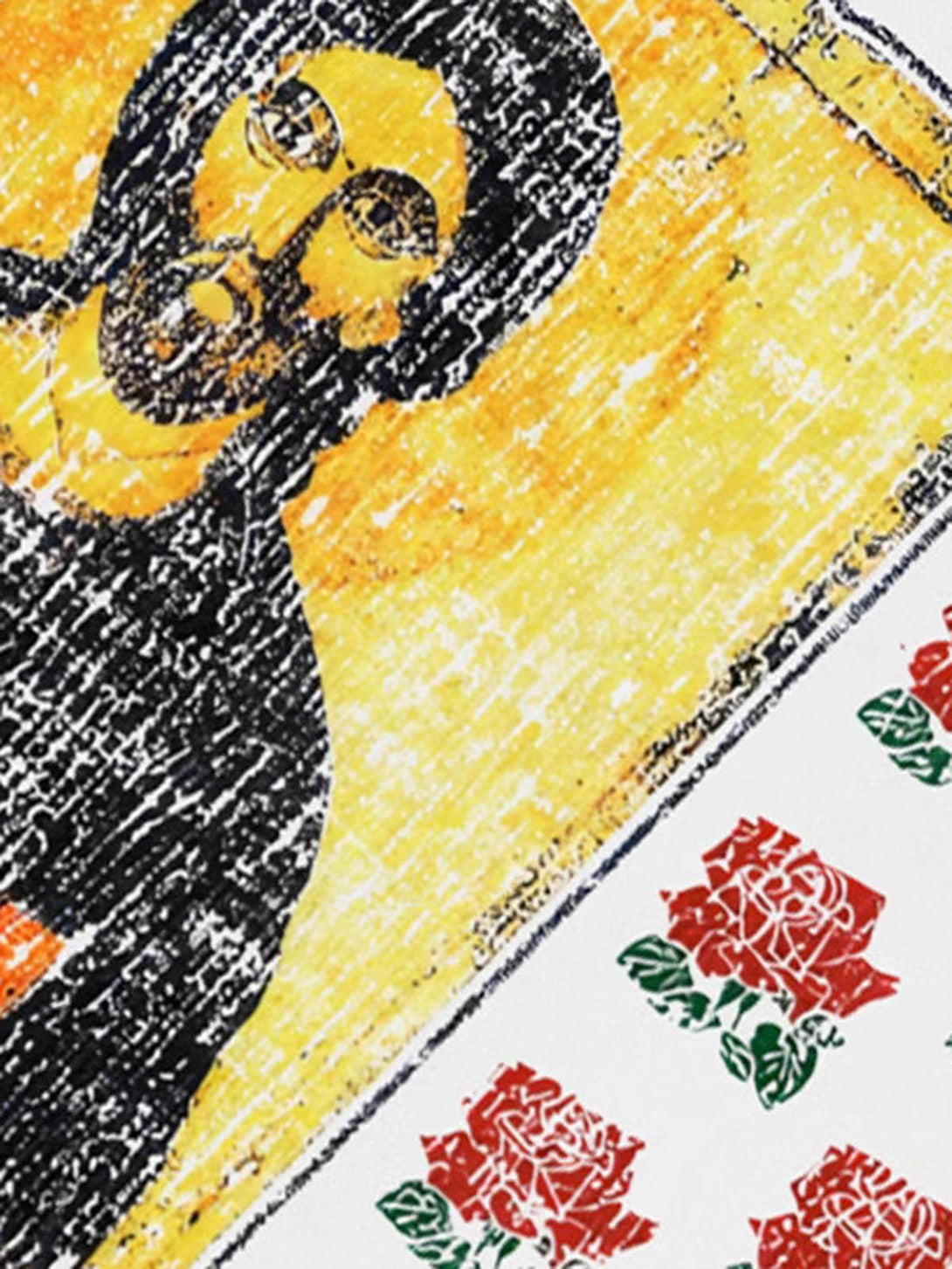 TALISHKO T-shirt with a close-up of floral graphics and religious icon design.