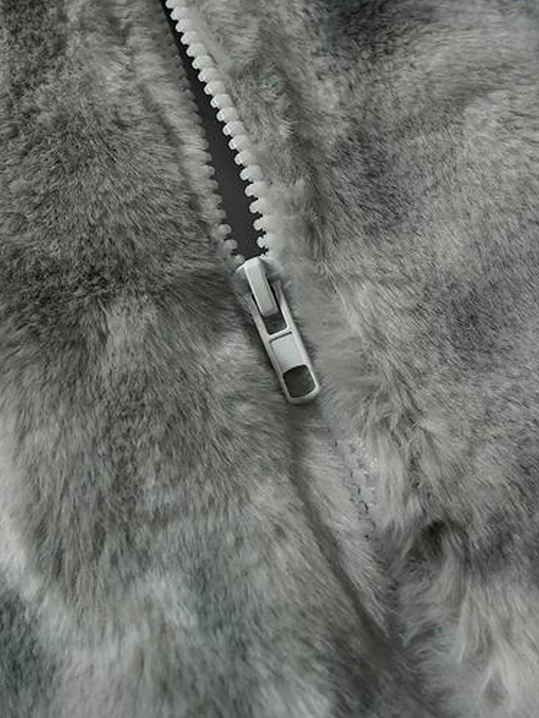 A close-up of TALISHKO's tie-dye urban jacket, showcasing the plush faux lambswool texture.
