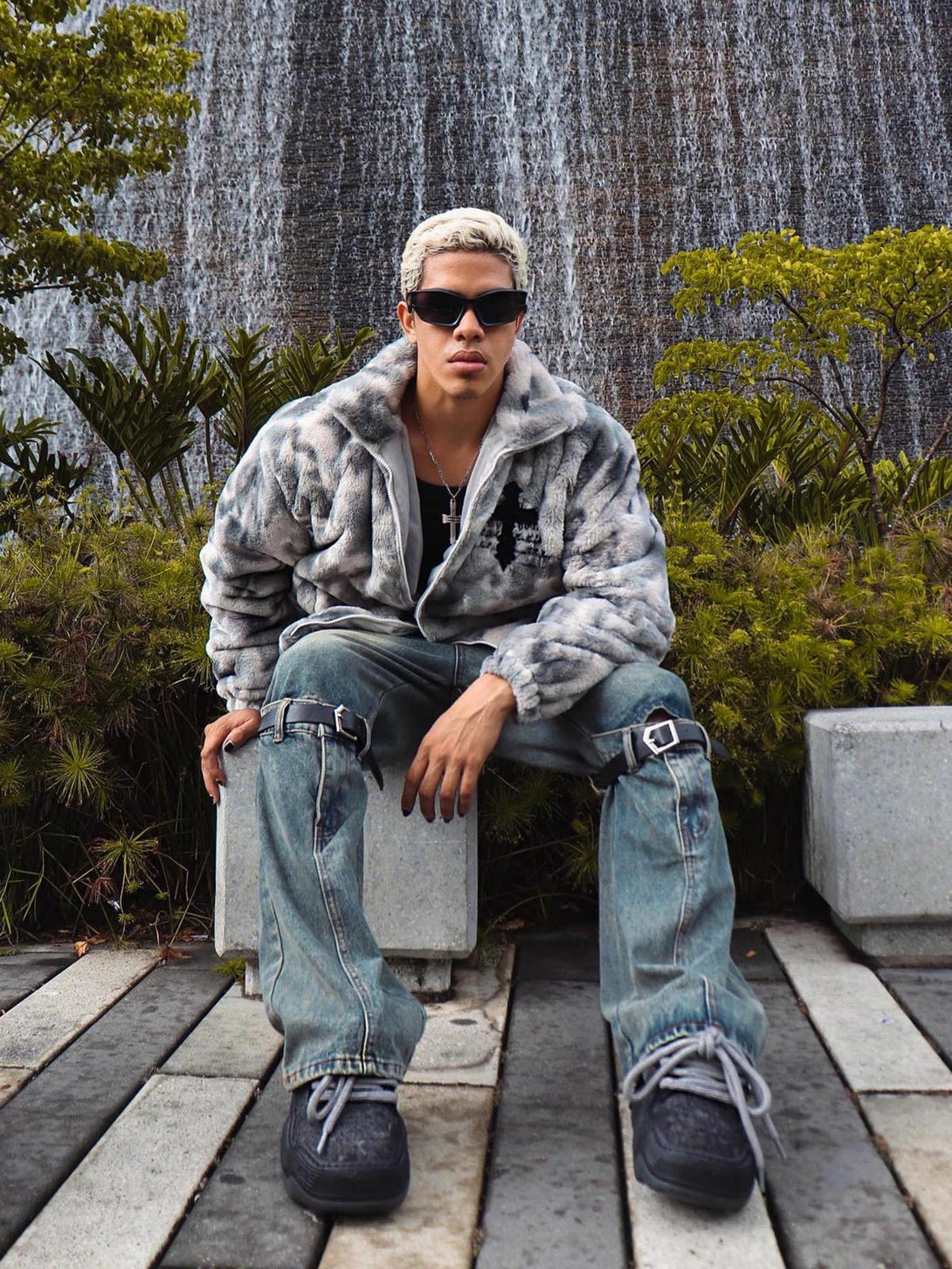 Urban vibe with TALISHKO's tie-dye faux lambswool jacket, styled casually in a natural setting.