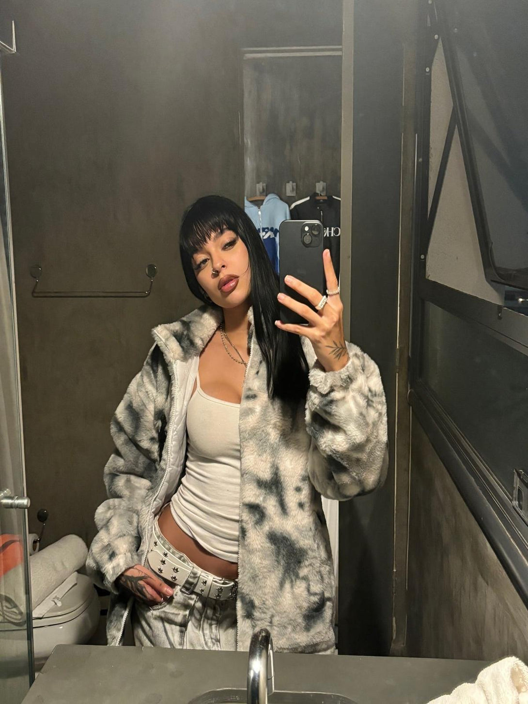 TALISHKO's tie-dye jacket in faux lambswool, styled casually with a chic urban vibe.