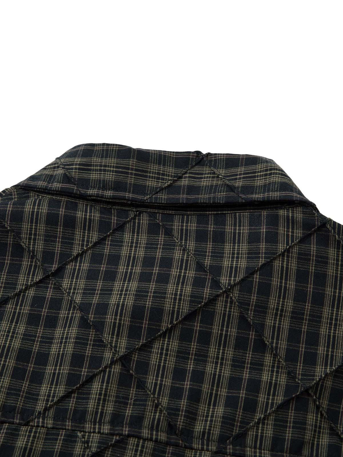 Intricate look at the plaid pattern and pleated design on the TALISHKO polo shirt.