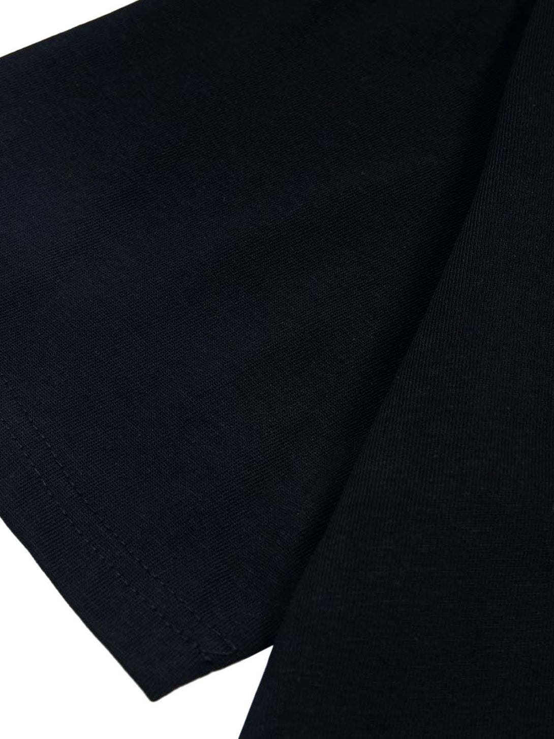Detailed fabric and stitching on a black TALISHKO T-shirt, highlighting its quality craftsmanship.