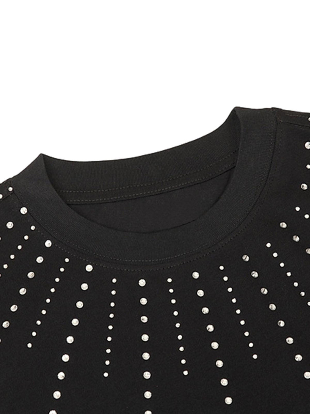 A detailed view of rhinestone embellishments on a black T-shirt by TALISHKO.