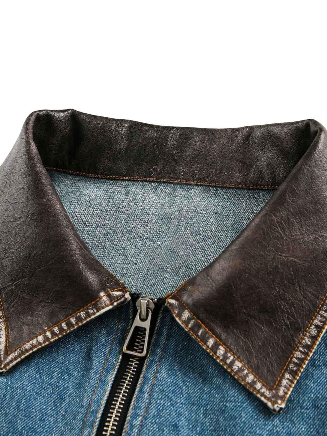 Focusing on the contrasting collar of TALISHKO's denim jacket, highlighting rich textures.