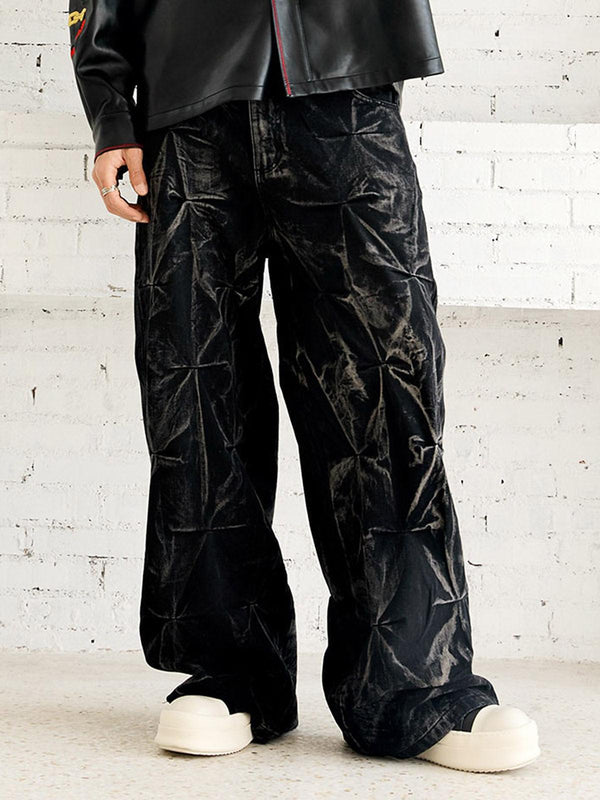 TALISHKO baggy jeans with a heavy washed, distressed pleated design worn by a model.