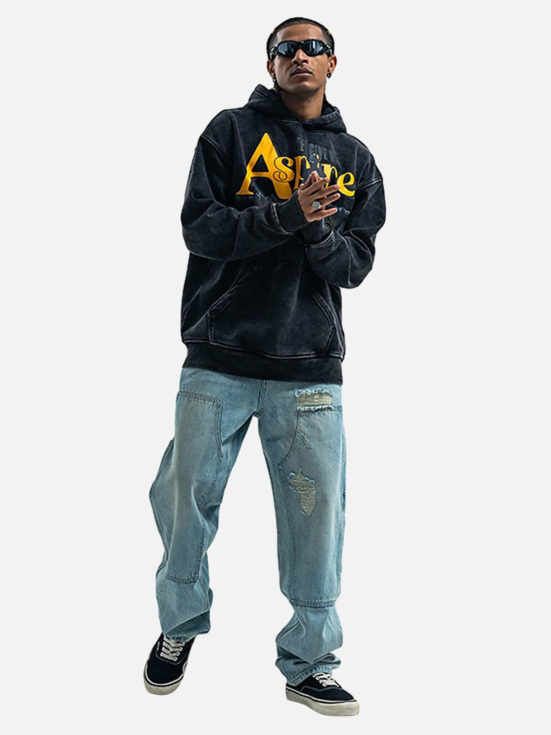 Model wearing a TALISHKO fleece hoodie with "Aspire" print, paired with casual denim jeans.