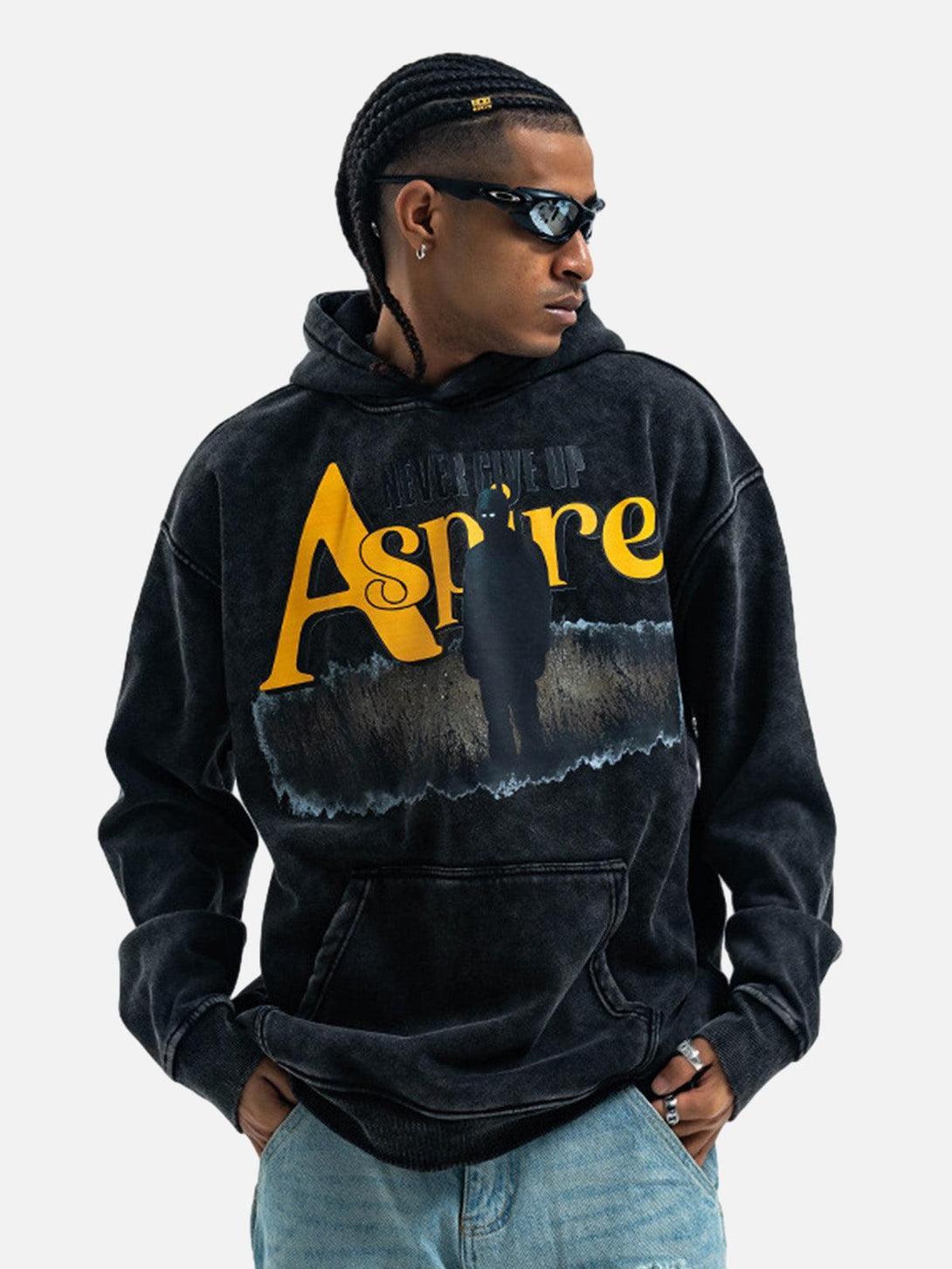 Model wearing TALISHKO fleece hoodie with "Aspire" print, embodying urban street style.