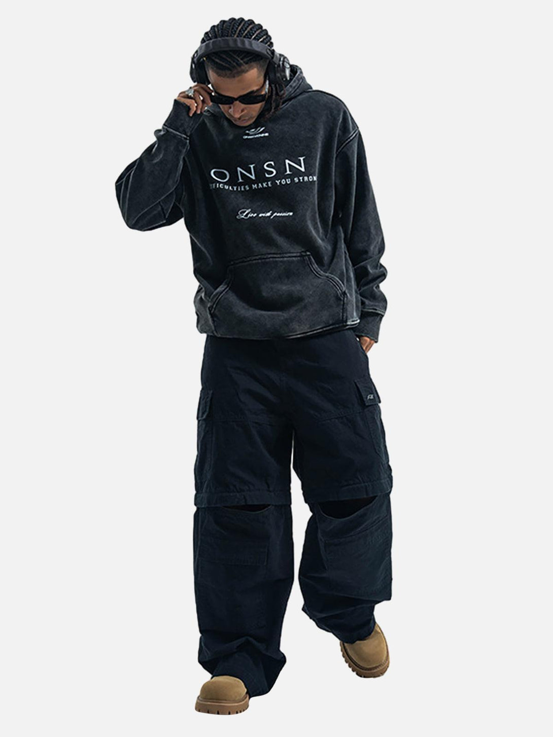 Model sporting a TALISHKO heavy washed fleece hoodie, paired with oversized cargo pants and boots.