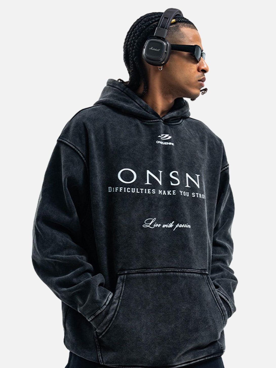 Model wearing TALISHKO heavy washed fleece hoodie, paired with sunglasses and headphones.