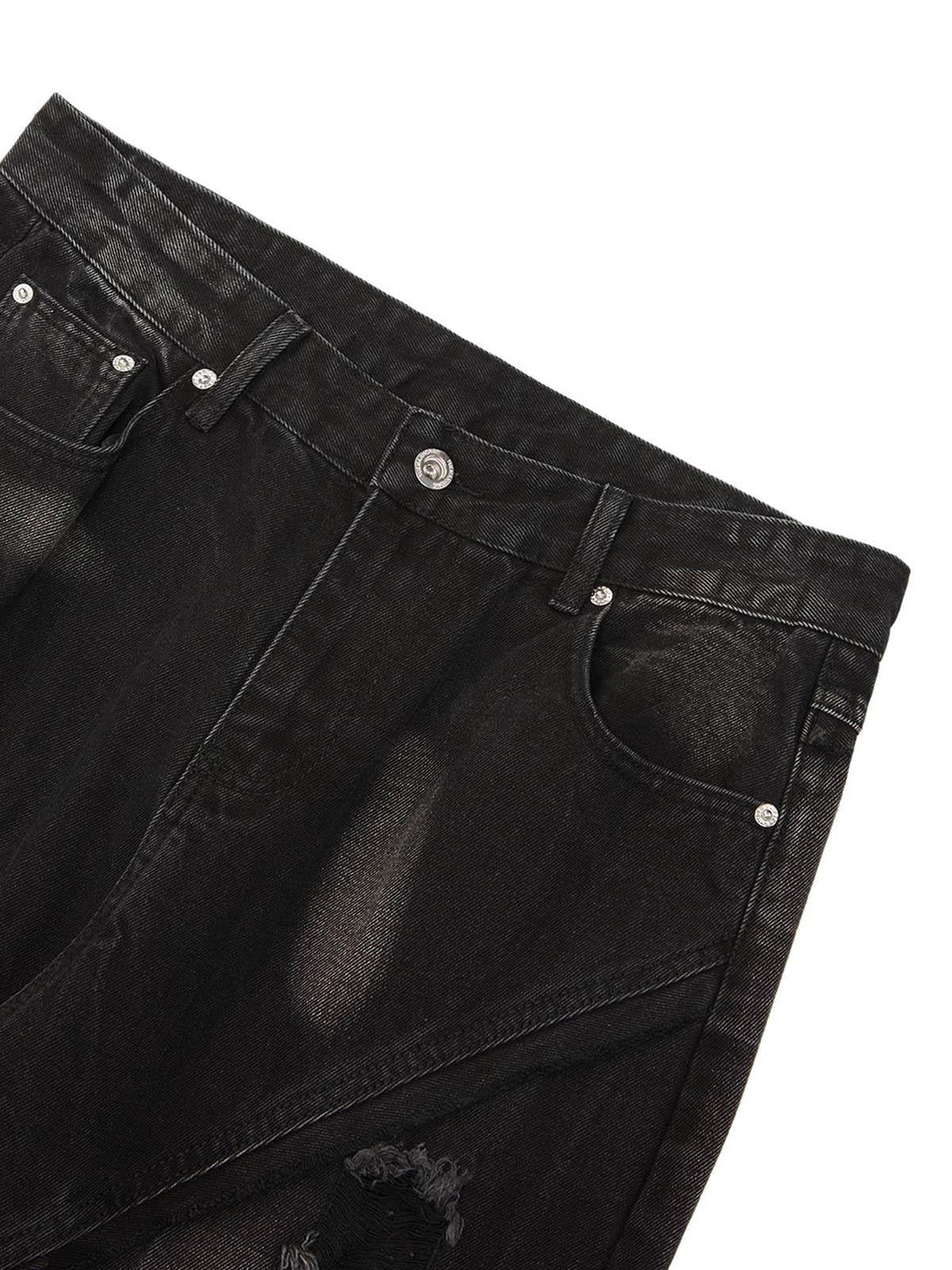 Close-up of TALISHKO hip-hop jeans showing ripped details and textured black fabric.